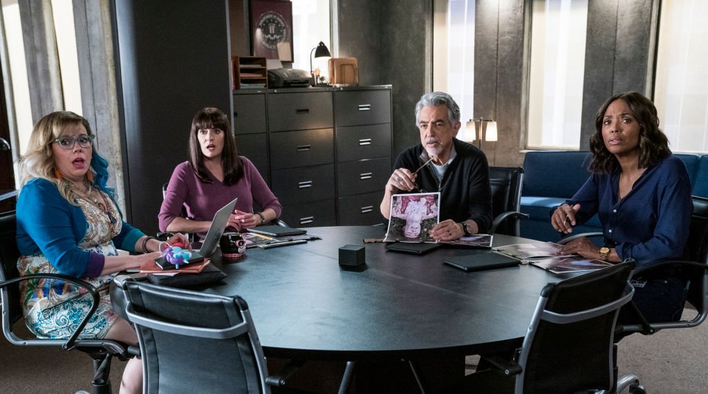 Kirsten Vangsness, Paget Brewster, Joe Mantegna, and Aisha Tyler sit around a table for an episode of "Criminal Minds" titled "Under the Skin," which aired on CBS January 25, 2019 | Source: Cliff Lipson/CBS via Getty Images