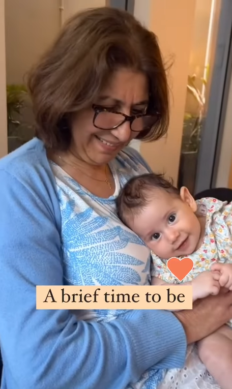 Susan cuddling her granddaughter in a post dated May 11, 2025 | Source: Instagram/kristyadlerart