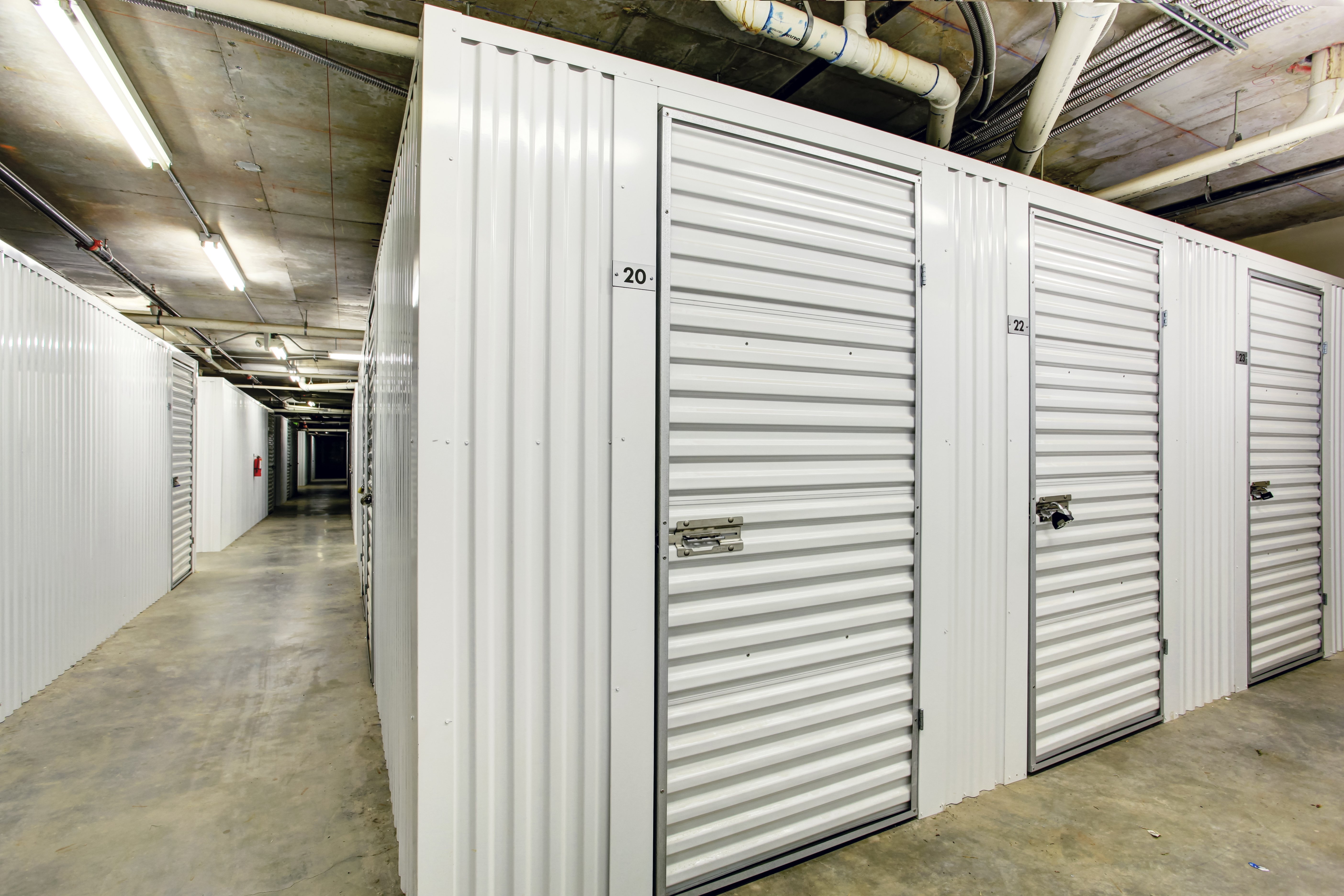 White storage units placed in the basement. | Source: shutterstock