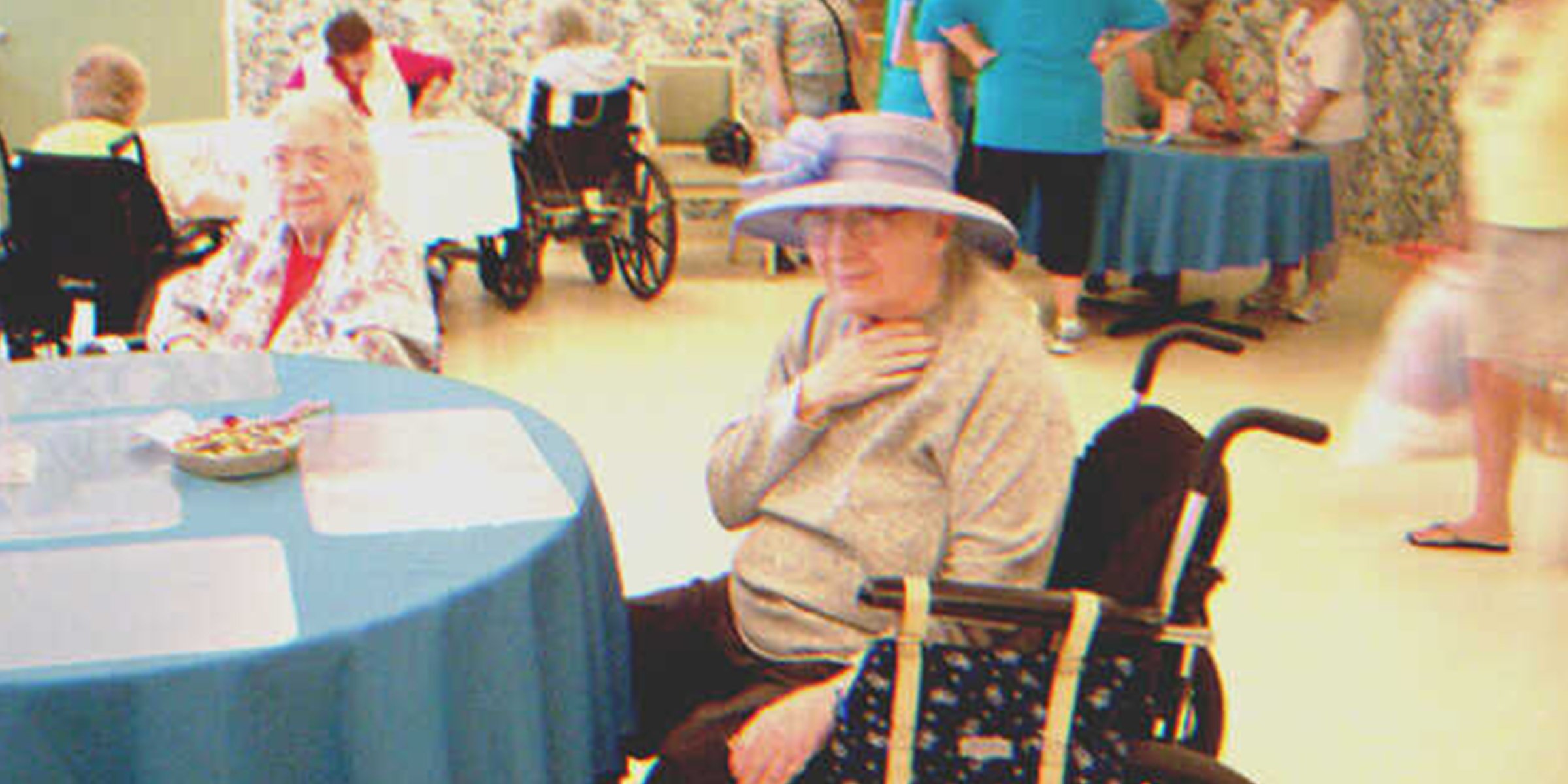 Two old ladies sitting at a table | Source: Shutterstock