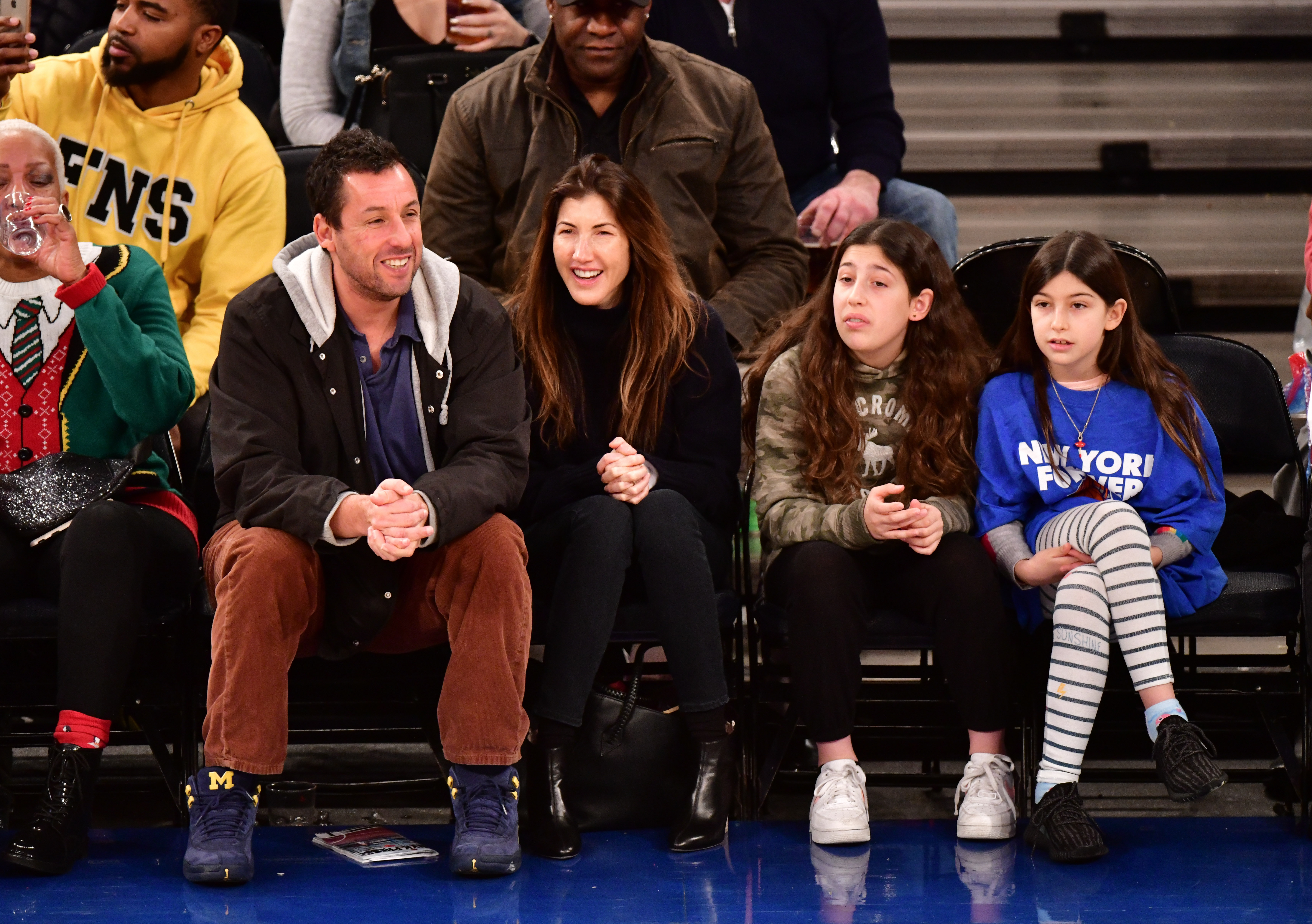 Adam, Jackie, Sadie, and Sunny Sandler at the Milwaukee Bucks vs New York Knicks game in New York on December 25, 2018. | Source: Getty Images