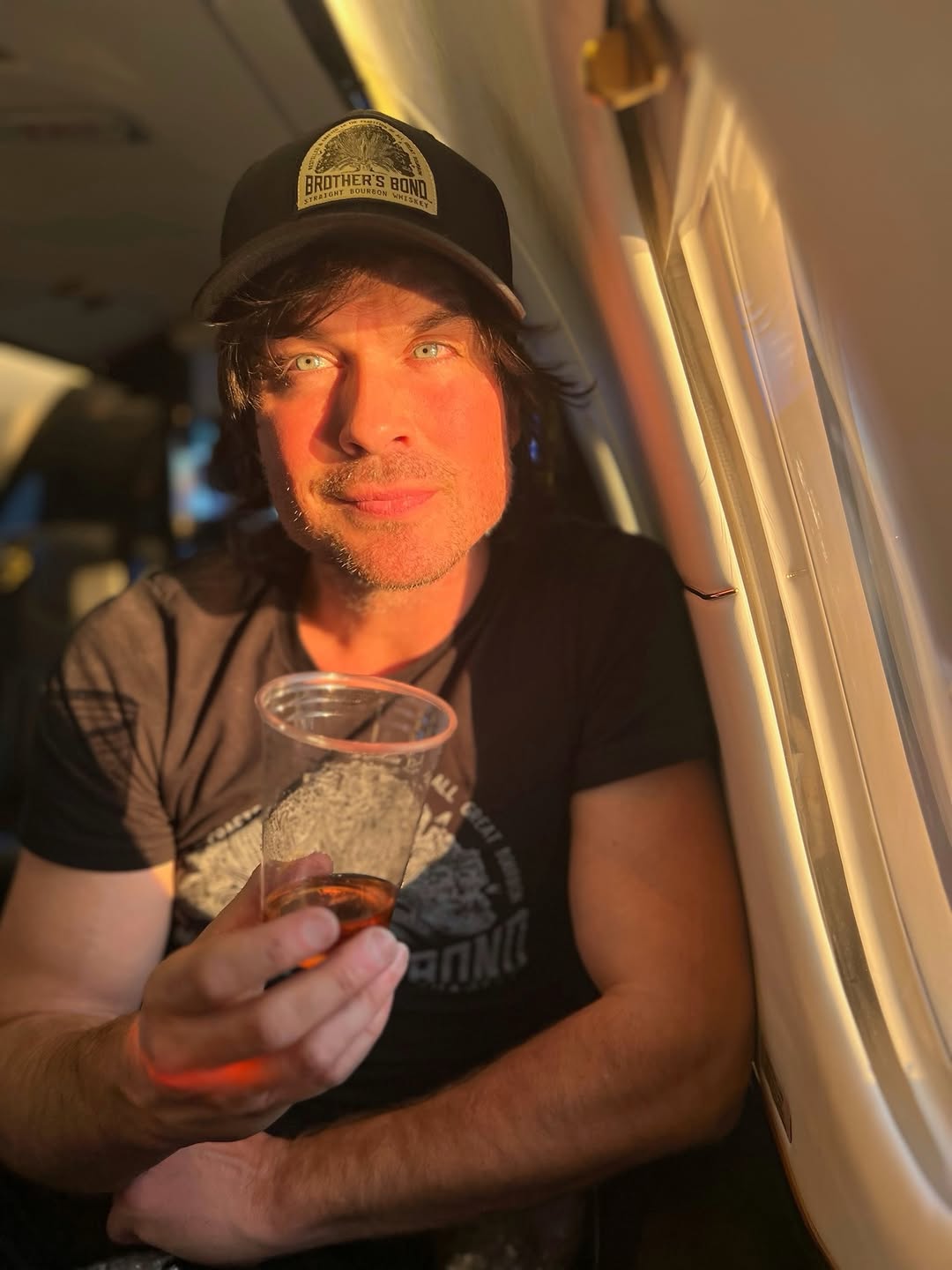 Ian Somerhalder looking on while seated on a plane, posted on April 14, 2026. | Source: Instagram/iansomerhalder