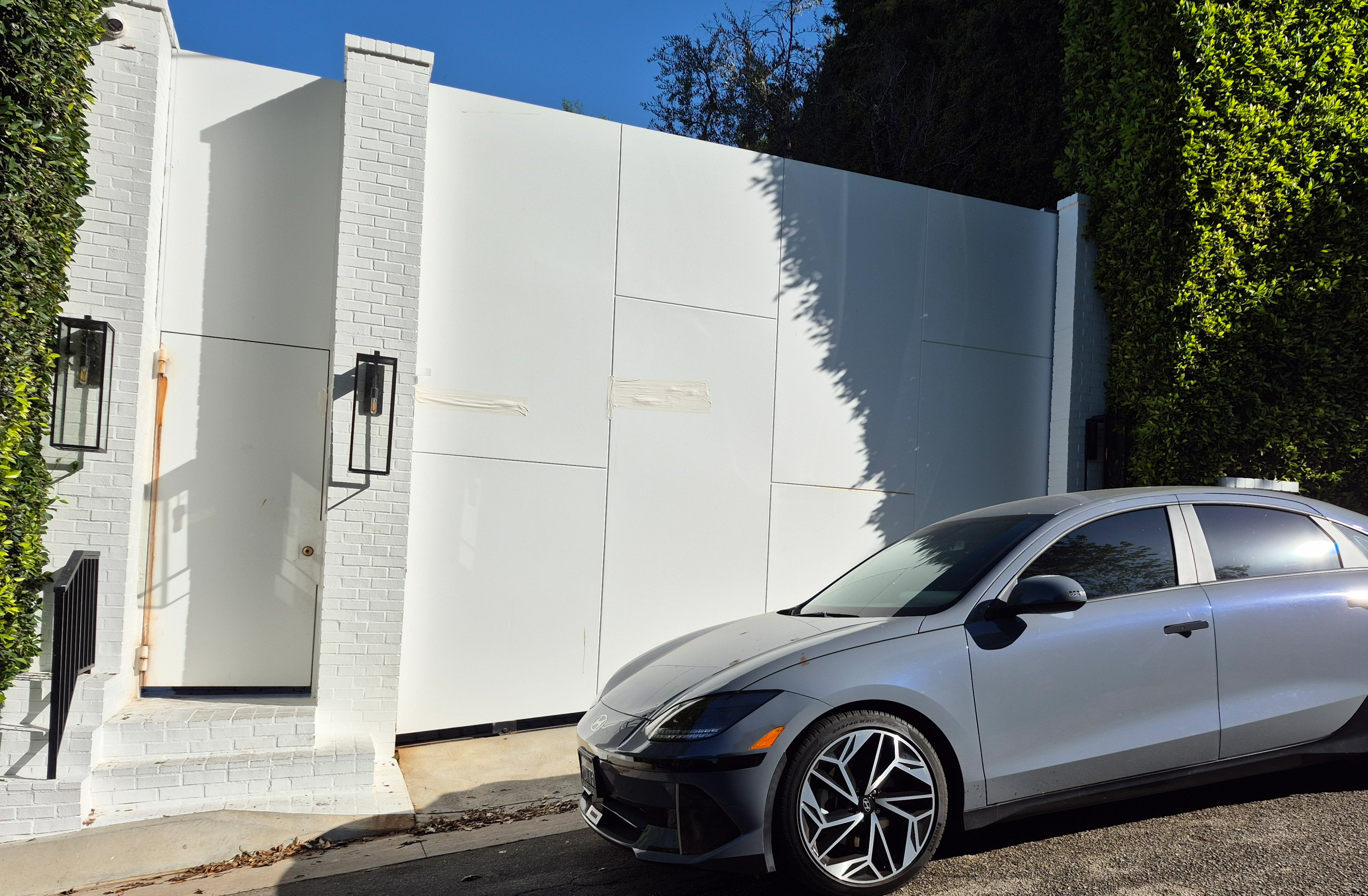 Tape covers an area allegedly struck by bullets at the entrance to Rihanna's home on March 9, 2026, in Beverly Hills, California | Source: Getty Images