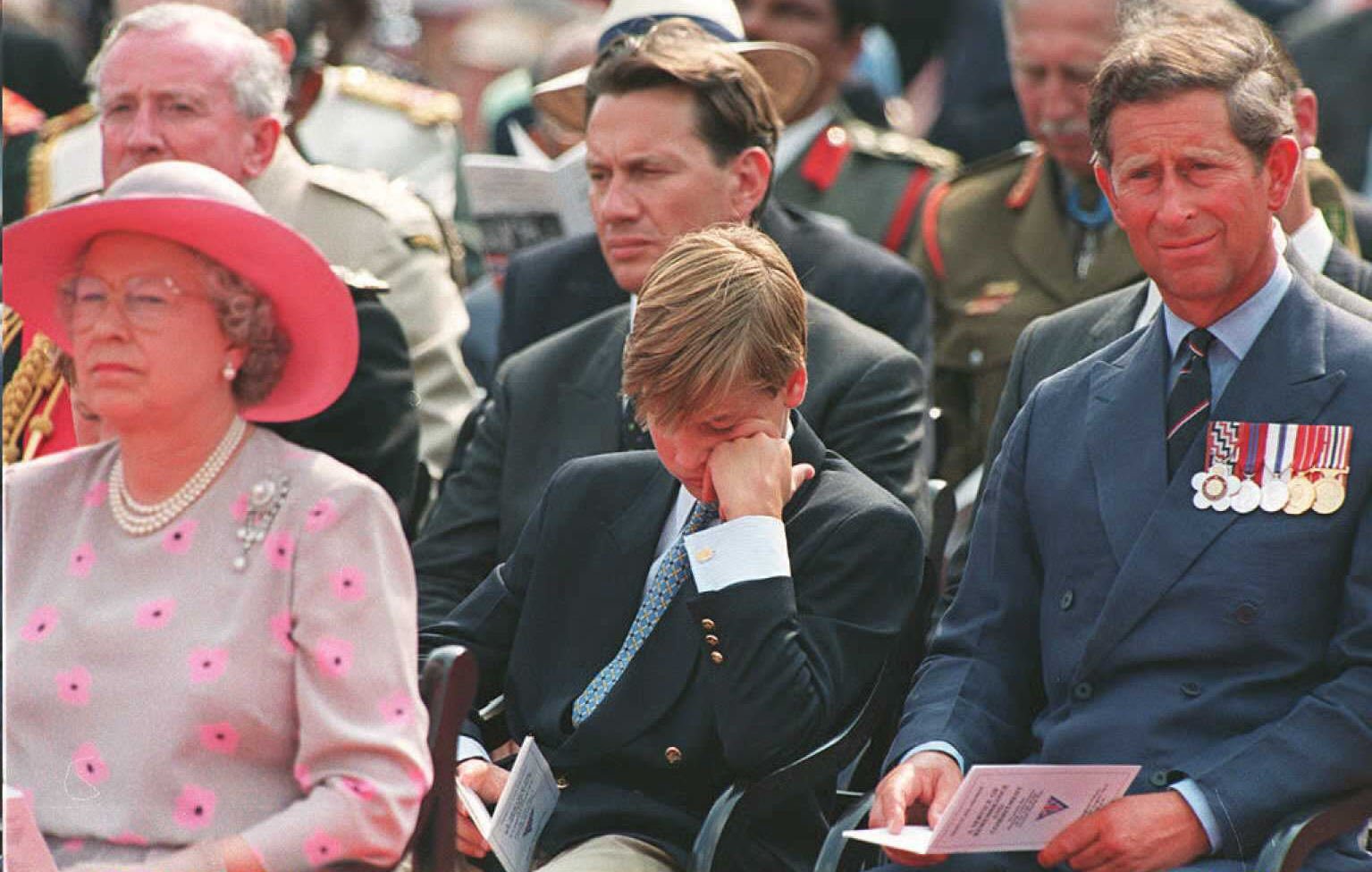 Queen Elizabeth II, Prince William and Prince Charles listen to the outdoor service commemorating VJ day on 19 August in London | Source: Getty Images