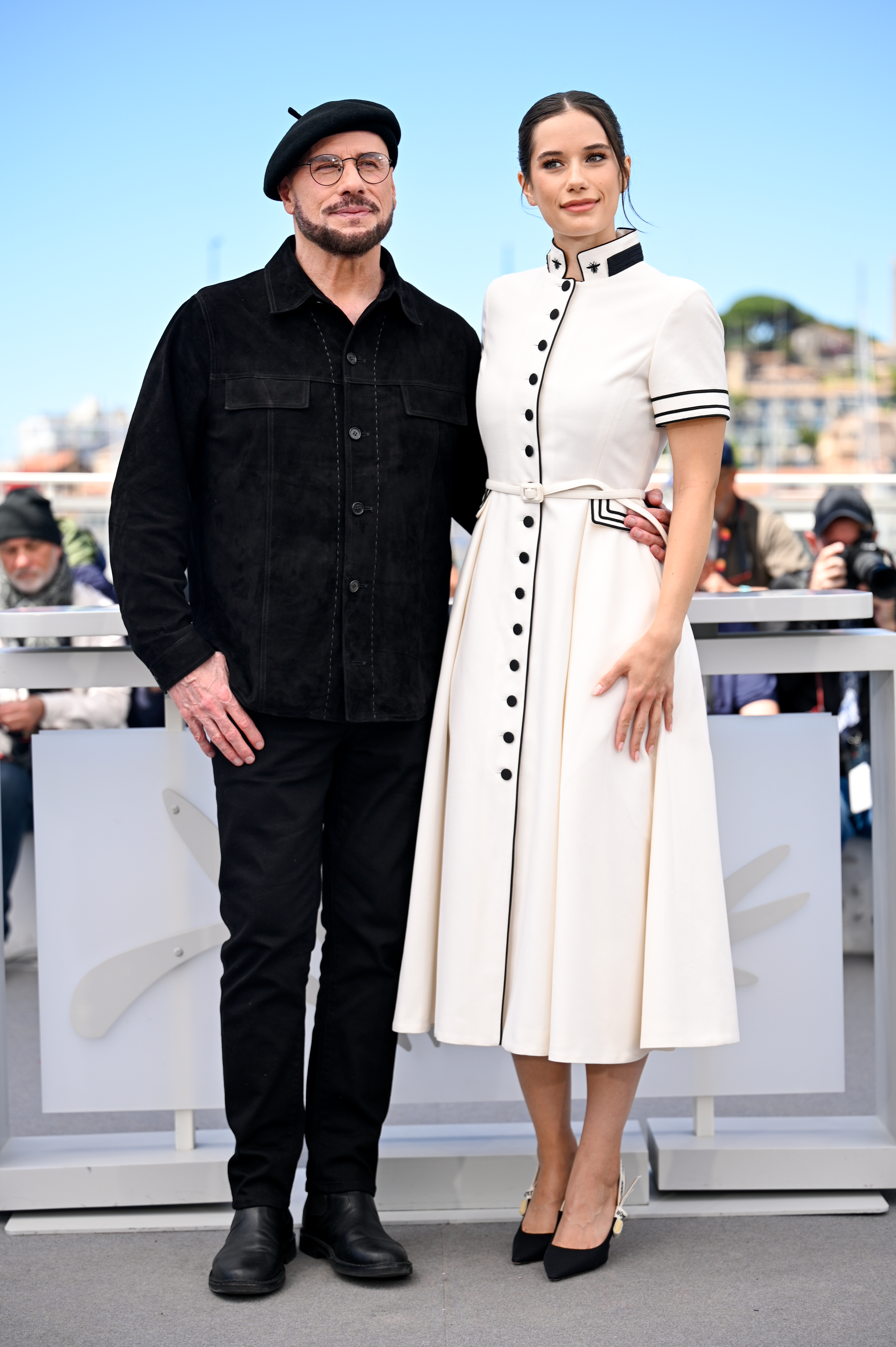 John and Ella Bleu Travolta attend the Official Cannes Film Festival Photocall for the Apple Original Film "Propeller One-Way Night Coach" at the rooftop of the Palais des Festival on May 16, 2026 in Cannes, France. | Source: Getty Images