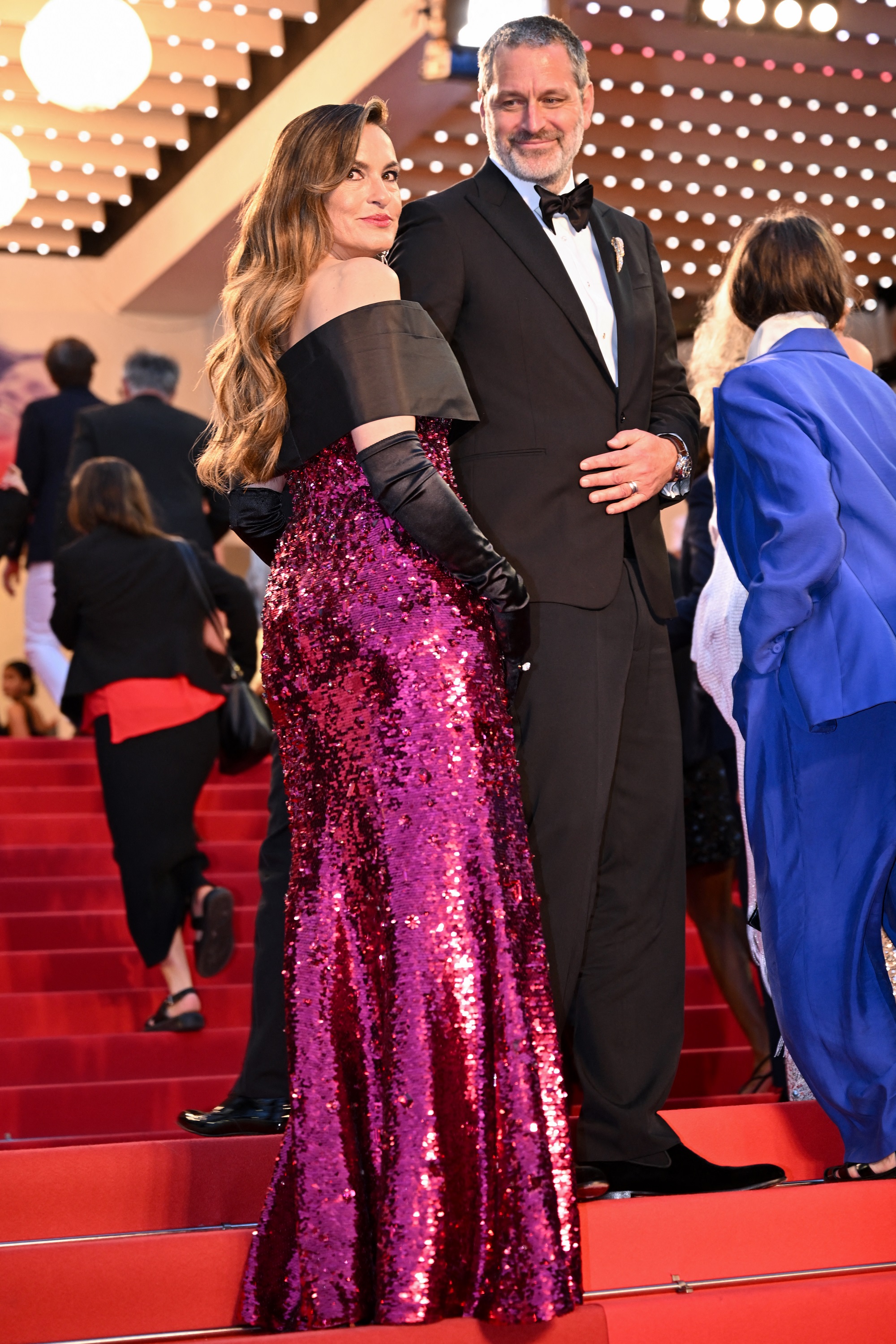 Peter looking at Mariska with unmistakable admiration, his expression full of pride and affection as she poses gracefully on the red carpet.