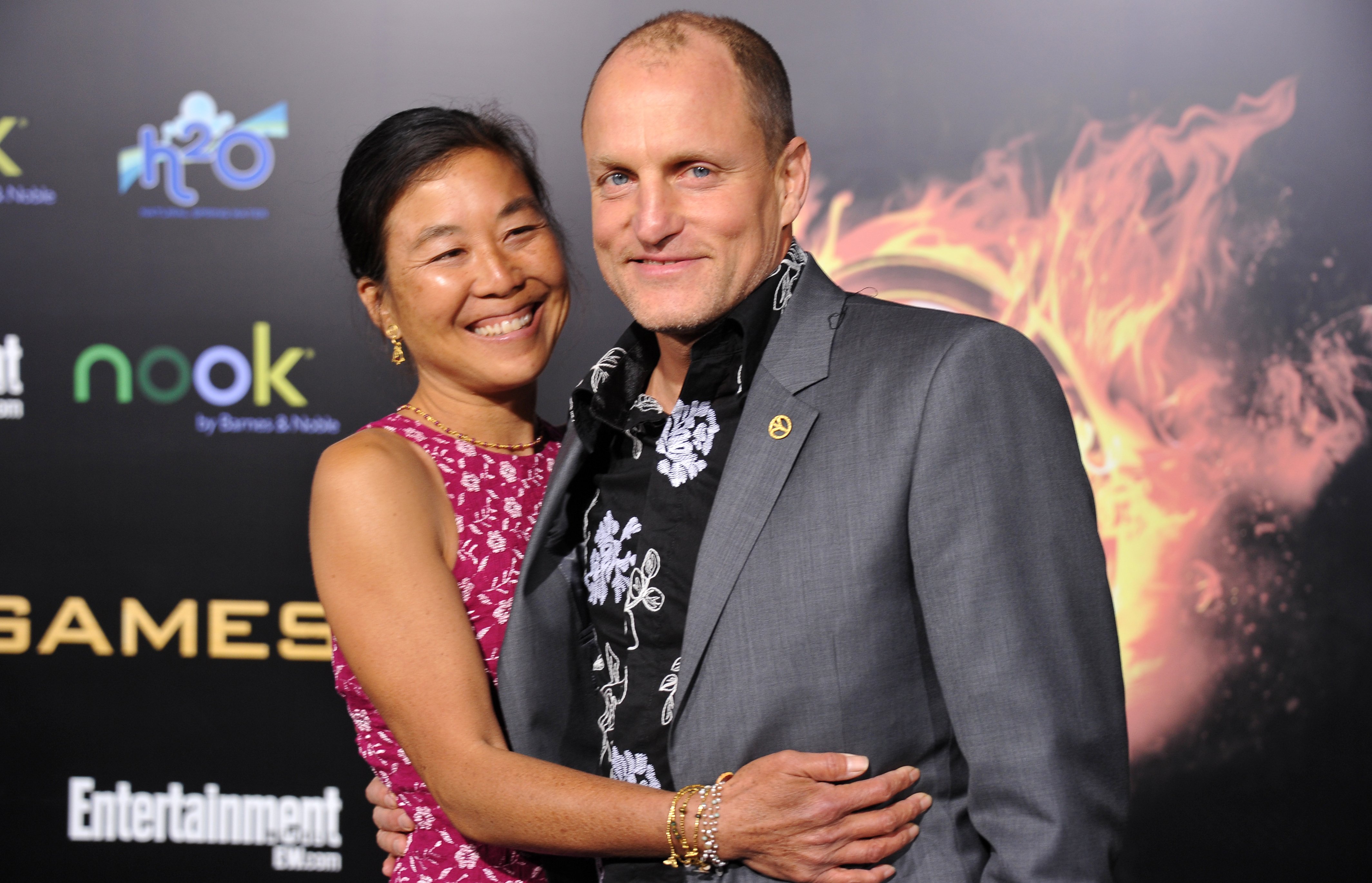 Woody Harrelson and Laura Louie at the premiere of "The Hunger Games" in 2012 in Los Angeles, California. | Source: Getty Images