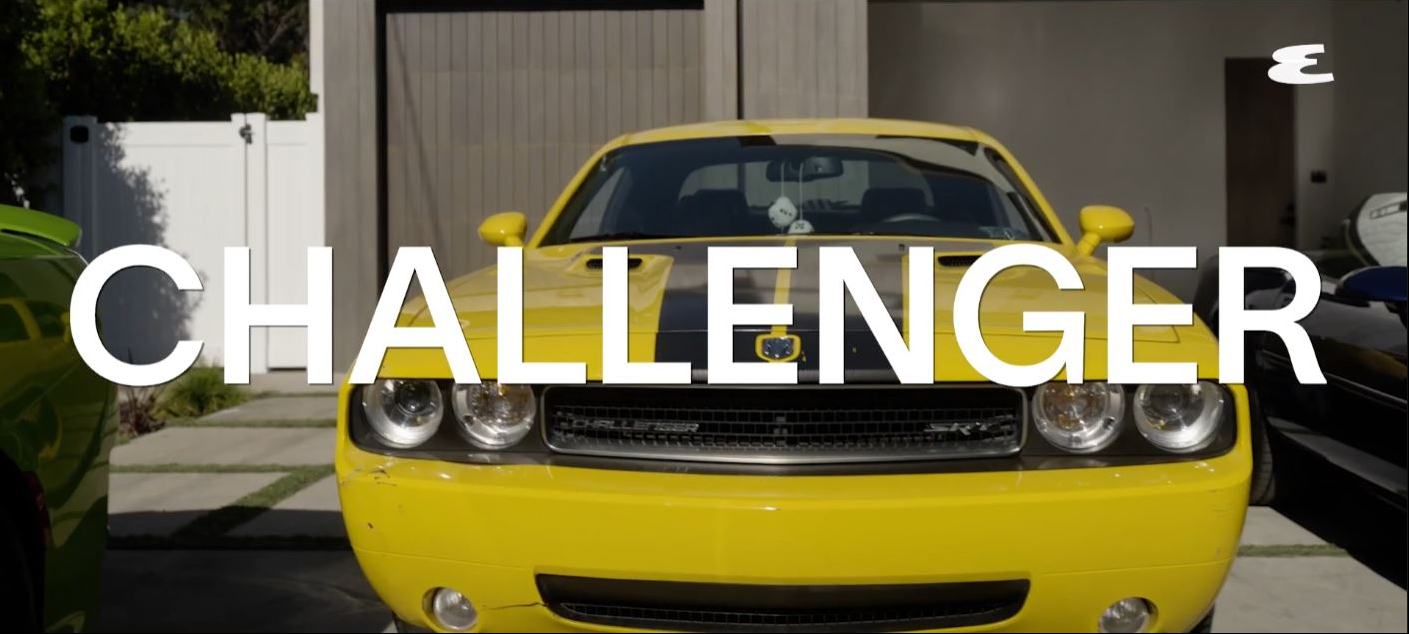 The black-and-yellow Dodge Challenger SRT8 that inspired Wiz Khalifa's breakthrough hit "Black and Yellow" remains one of the most recognizable vehicles in his collection. | Source: YouTube/Esquire