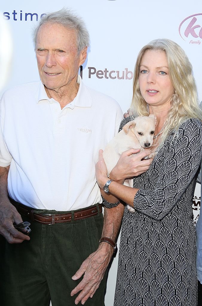 Clint Eastwood and Christina Sandera attend Eastwood Ranch Foundations hosts 1st annual Fall Garden Party Animal Rescue Fundraiser on November 7, 2015, in Malibu | Source: Getty Images