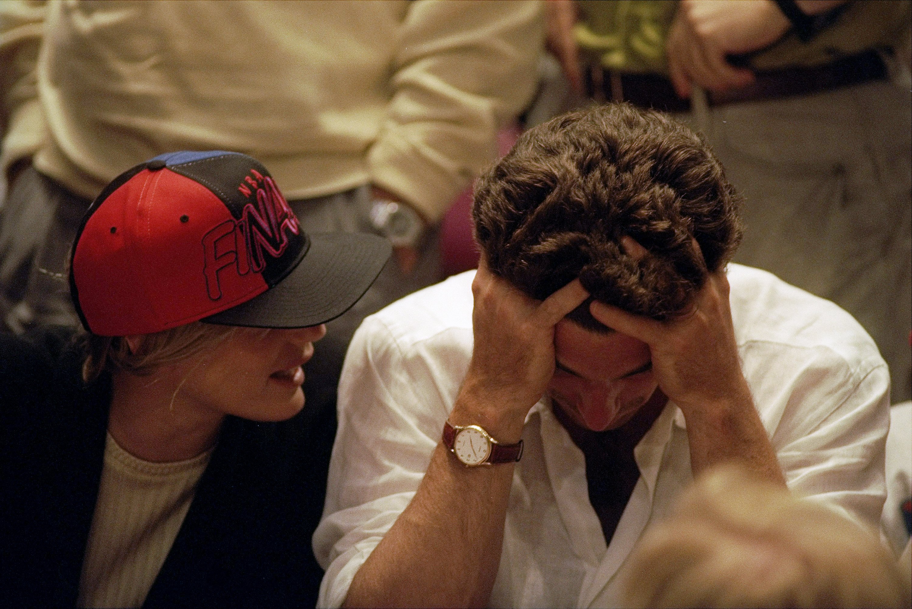 John F. Kennedy Jr. pictured with his head down while his girlfriend, Daryl Hannah, talks to him during game between the New York Knicks and the Houston Rockets at Madison Square Garden. / Source: Getty Images
