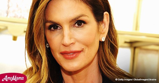 Cindy Crawford sports a flowing navy dress, revealing how youthful she looks at the age of 52