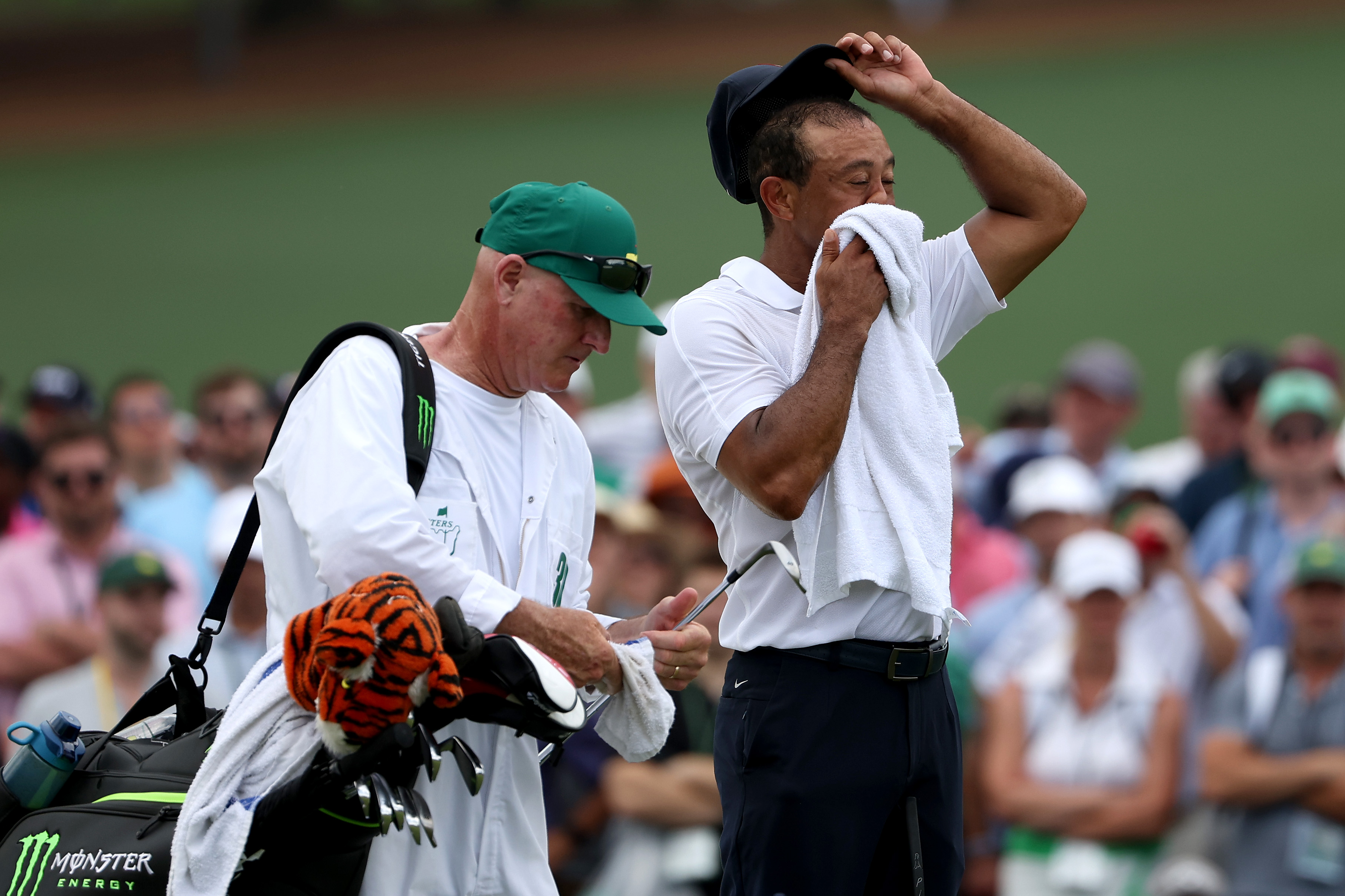 Tiger Woods and caddie Joe LaCava look on during the first round of the 2023 Masters Tournament at Augusta National Golf Club in Augusta, Georgia on April 6. | Source: Getty Images