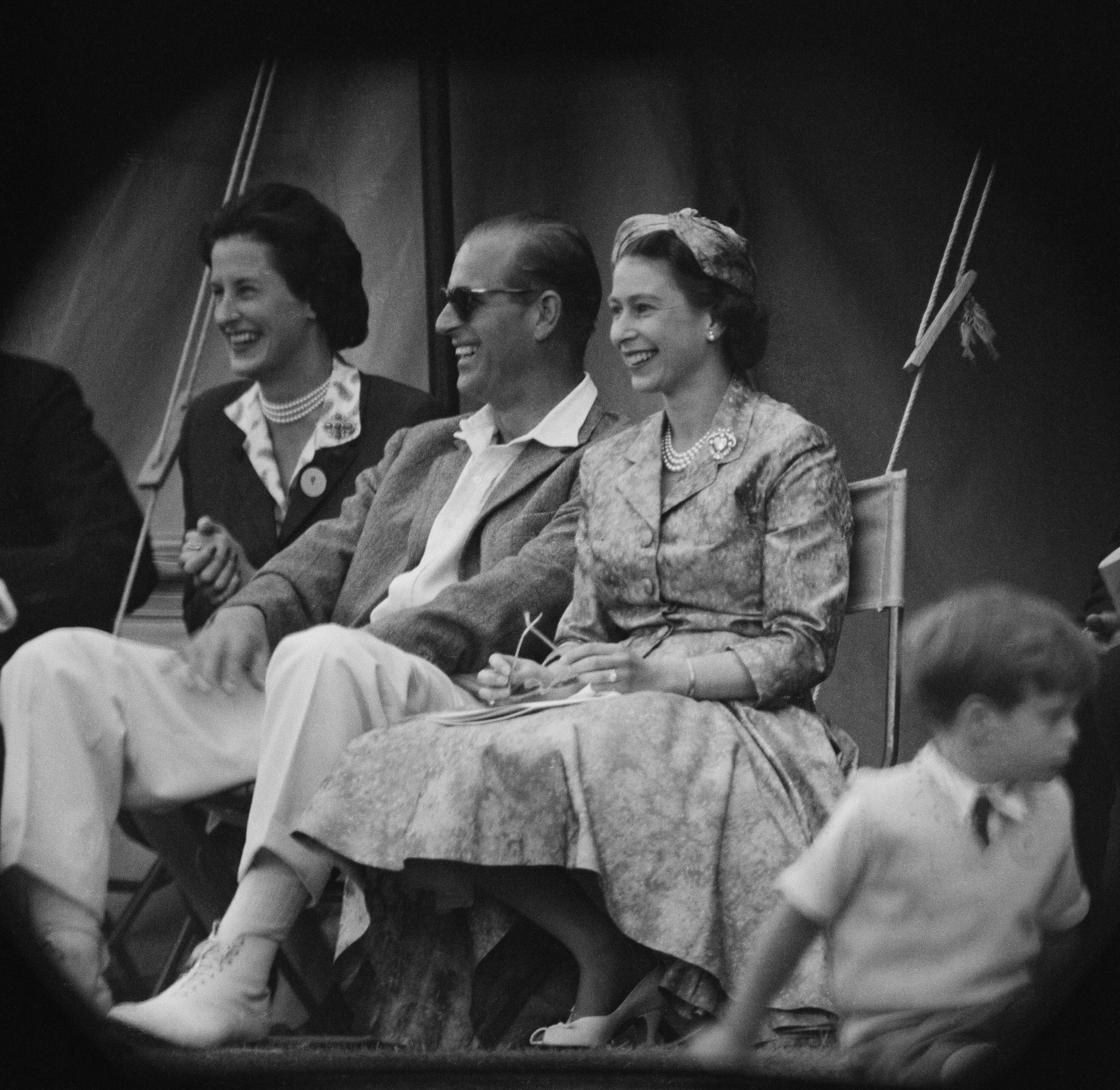 Queen Elizabeth II and Prince Philip, Duke of Edinburgh watch a cricket match. | Source: Getty Images