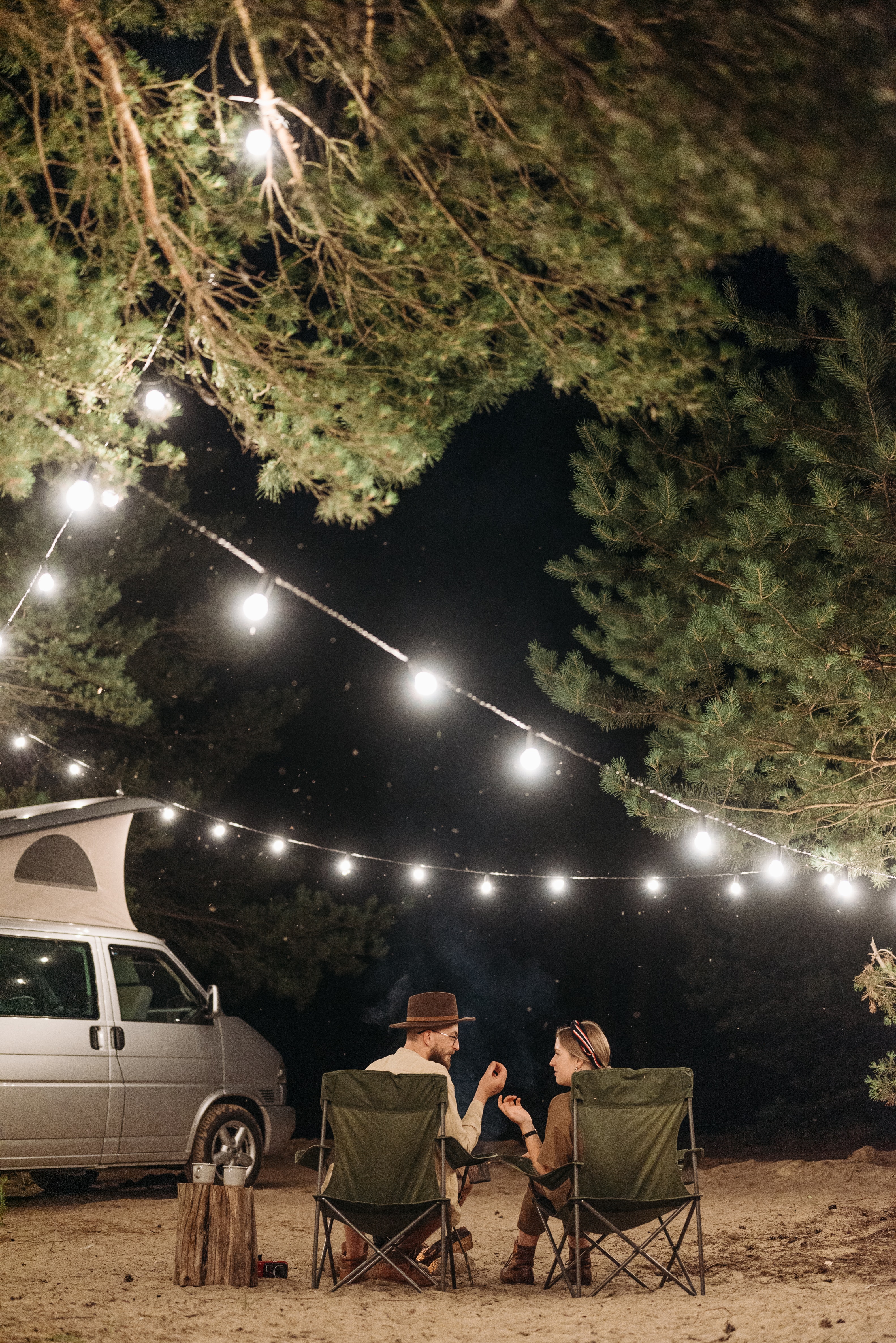 A couple camping and having a conversation. | Source: Pexels