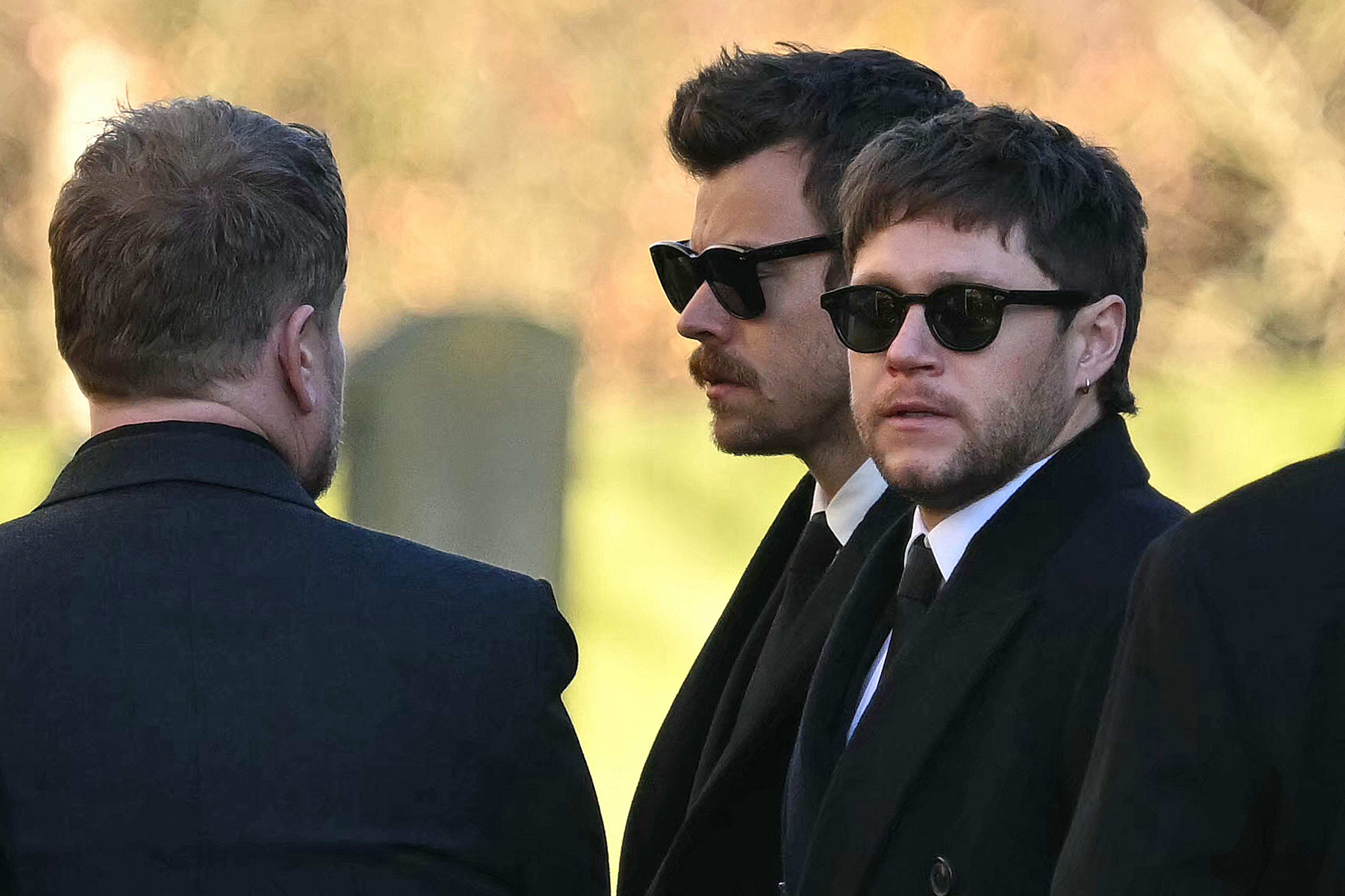 Harry Styles (C) and Niall Horan attend Liam Payne's funeral service at a St Mary's church on November 20, 2024, in Amersham, England. | Source: Getty Images