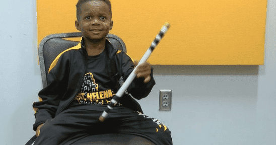 Drumming prodigy Jeremiah Travis with his drumstick. | Photo: twitter/wave3news