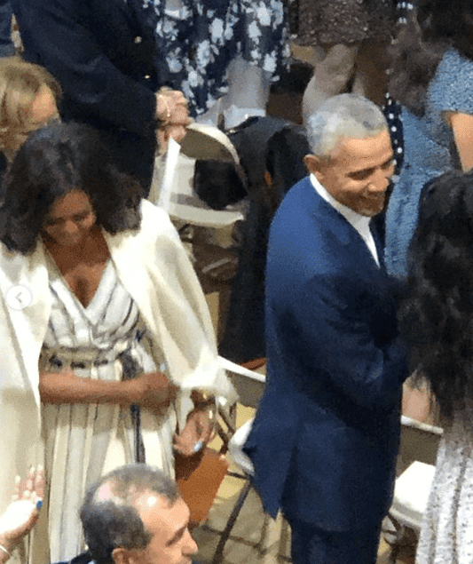 Barack and Michelle Obama mingling with other guests at their daughter Sasha Obama's high school graduation at Sidwell High School. | Source: Instagram/kceesq