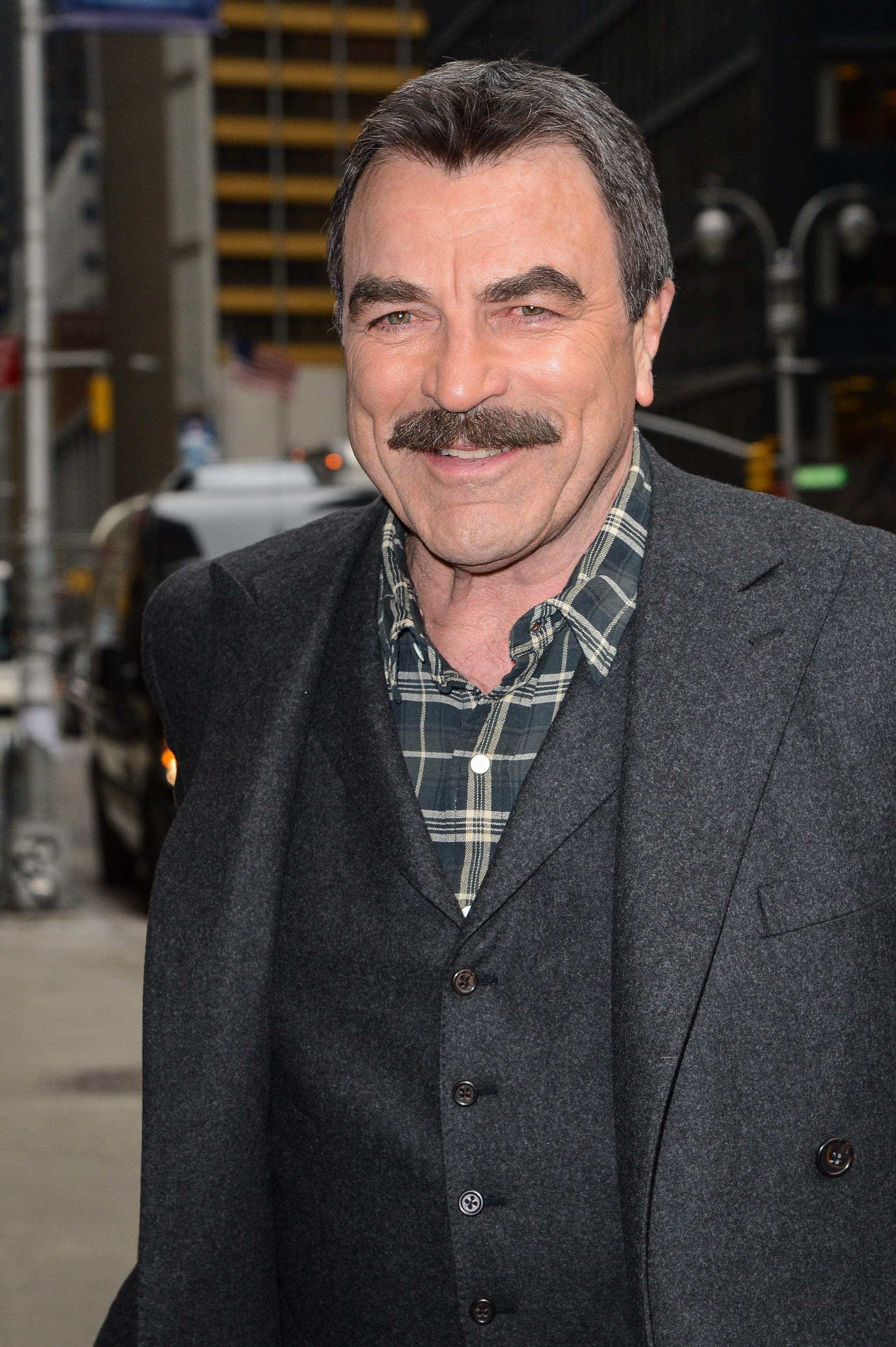 Tom Selleck enters the "Late Show With David Letterman" taping at the Ed Sullivan Theater on March 5, 2014, in New York City | Source: Getty Images