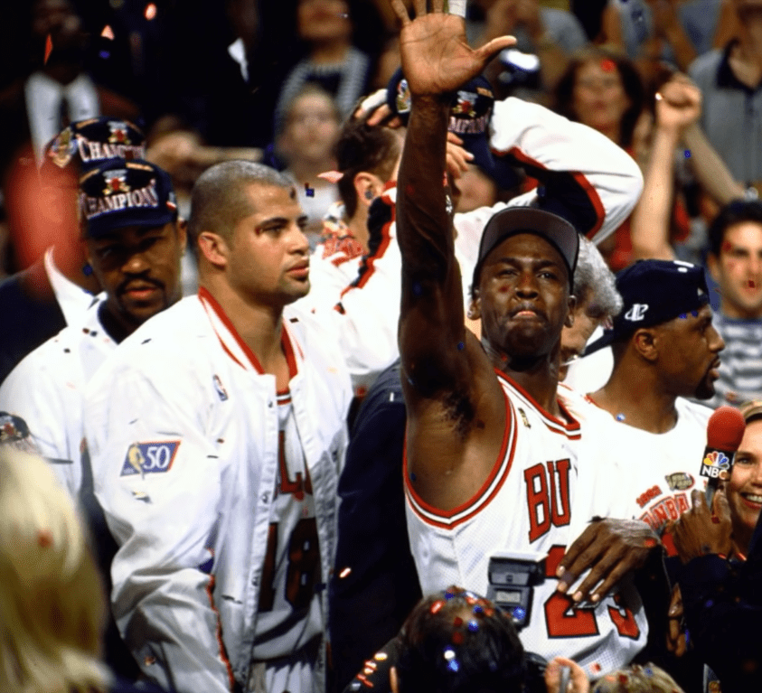 Bison Dele and Michael Jordan after winning an NBA Championship in 1997 | Photo: YouTube/NBA Insider