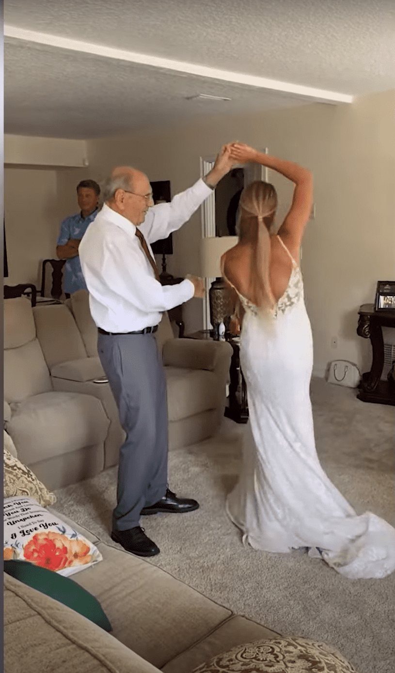 Bride who traveled over 600 miles to dance with her grandfather. | Photo: YouTube/SWNS