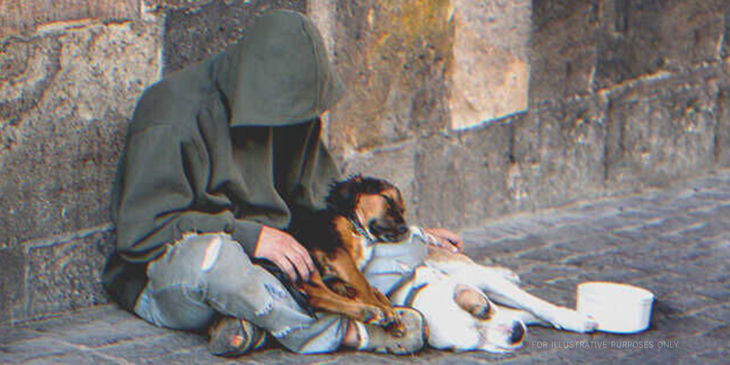 Hungry Beggar Sitting With Dogs | Source: Shuttterstock