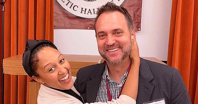 Tamera Mowry Of The Real Gives Husband Adam Housley A Kiss At Their