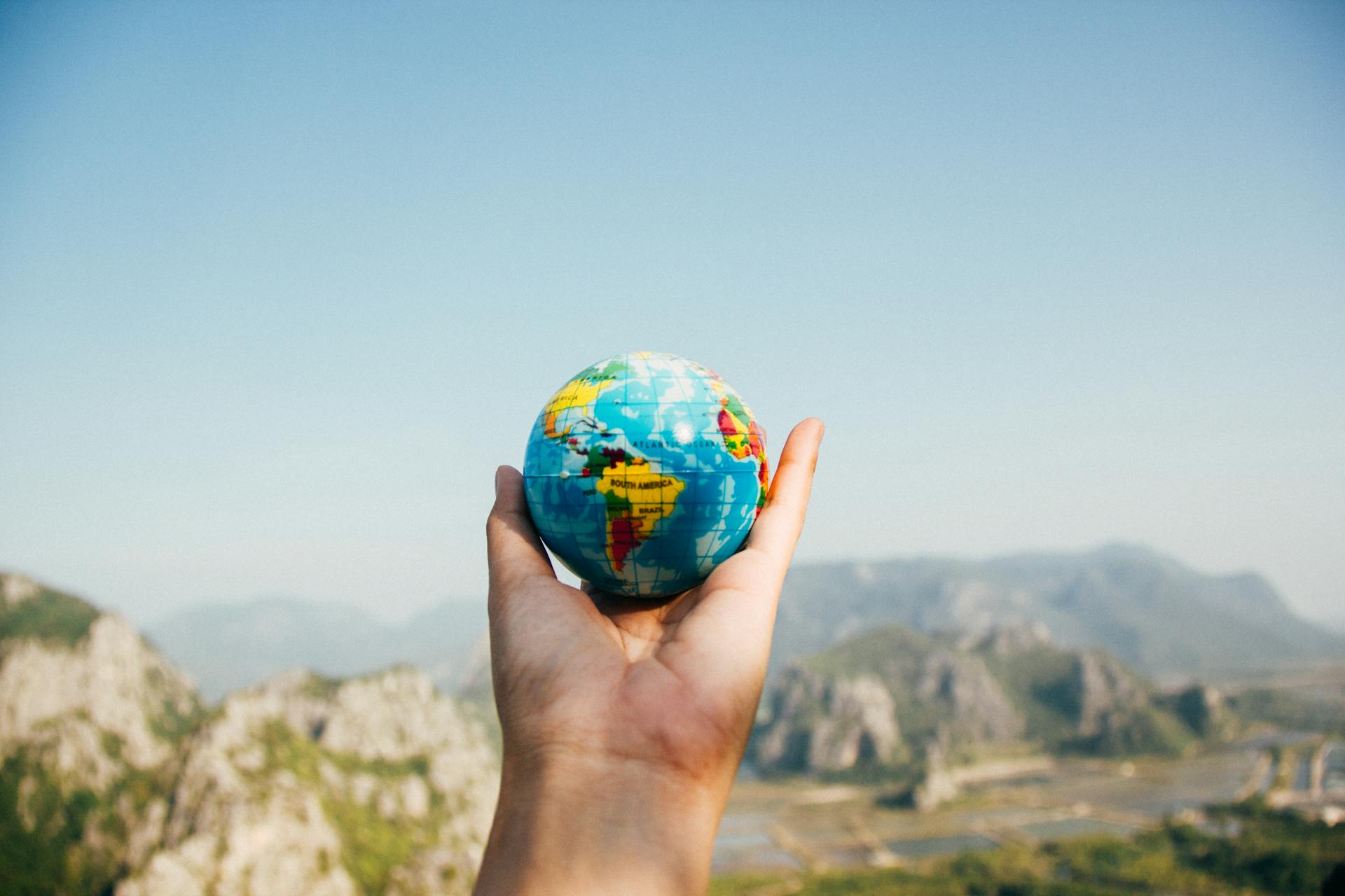 A person holding a globe | Source: Pexels