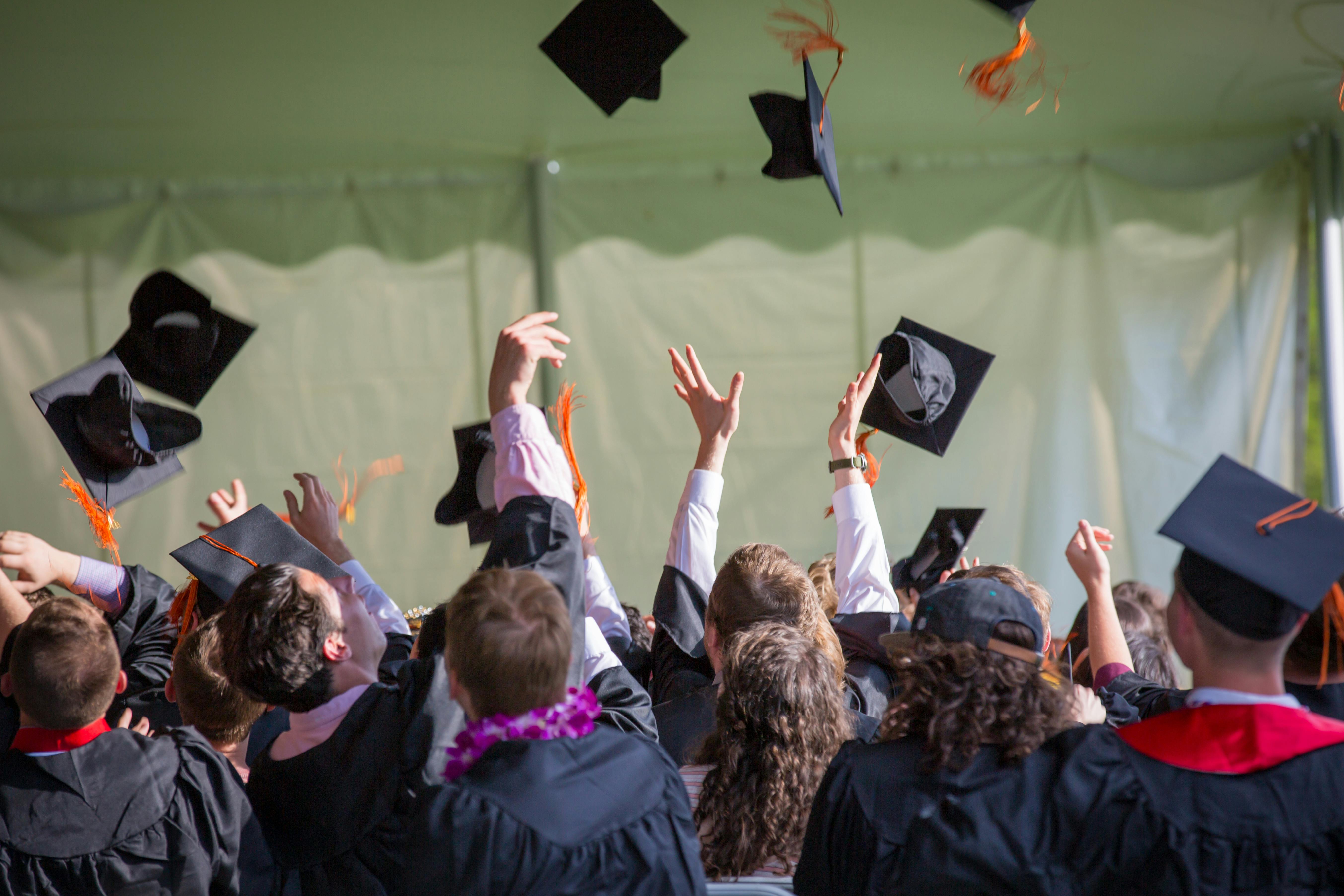 A group of students throwing their graduation caps into the air | Source: Emily Ranquist on Pexels