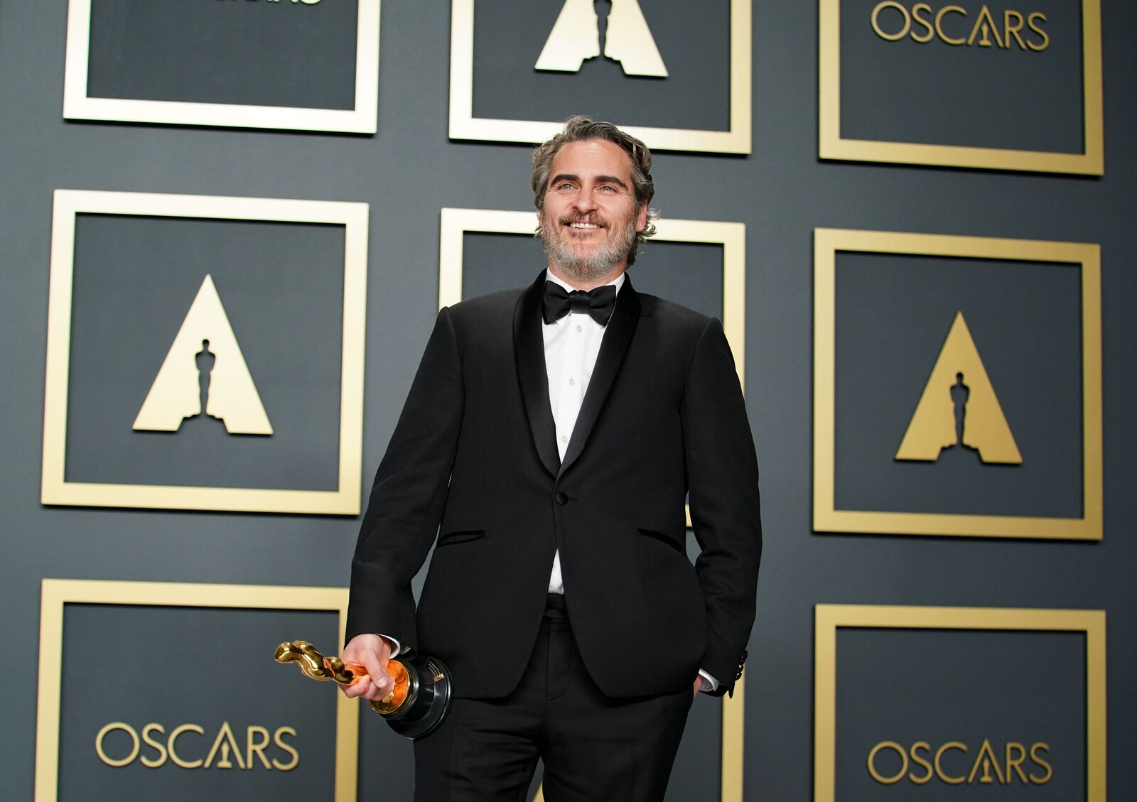 Joaquin Phoenix poses in the press room during the 92nd Annual Academy Awards on February 09, 2020, in Hollywood, California | Photo: Rachel Luna/Getty Images