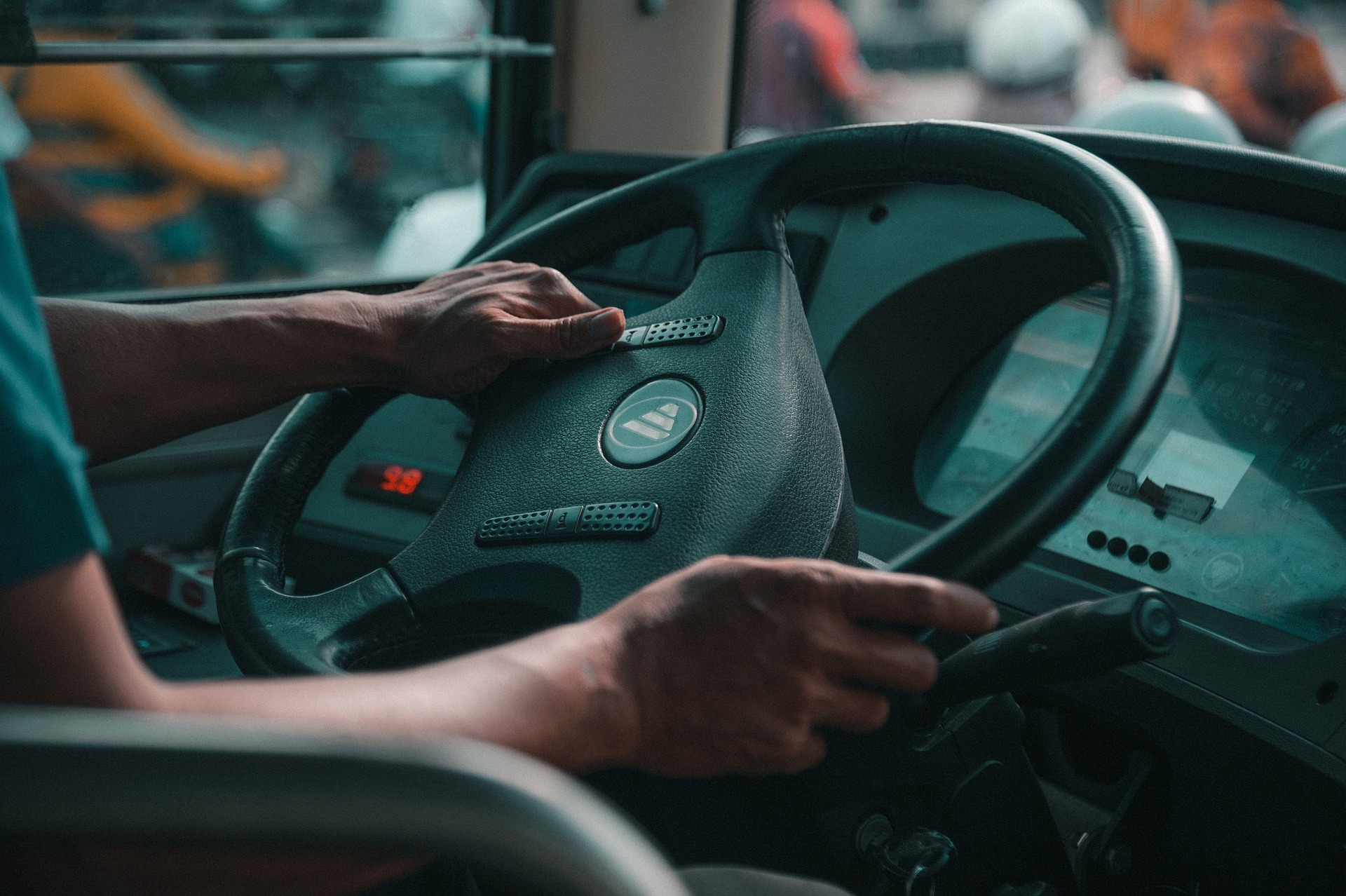 A close-up shot of a bus driver holding a steering wheel | Source: Pixabay