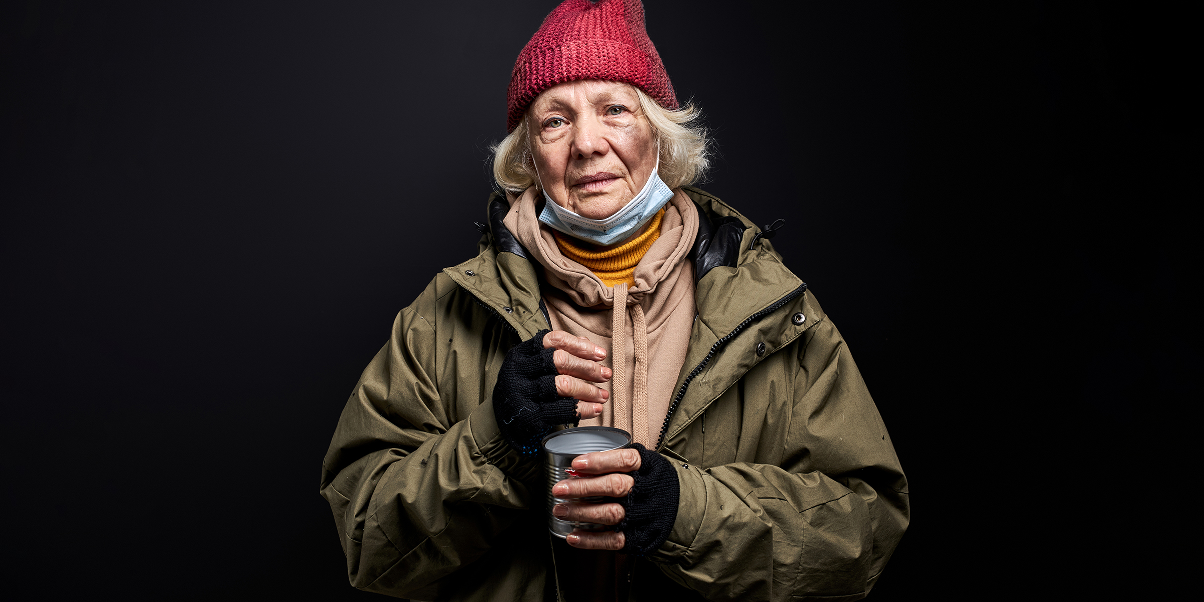 An elderly homeless woman | Source: Shutterstock