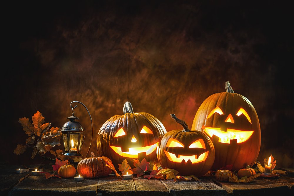 A photo of a Halloween pumpkin head jack lantern with burning candles. | Photo: Shutterstock.