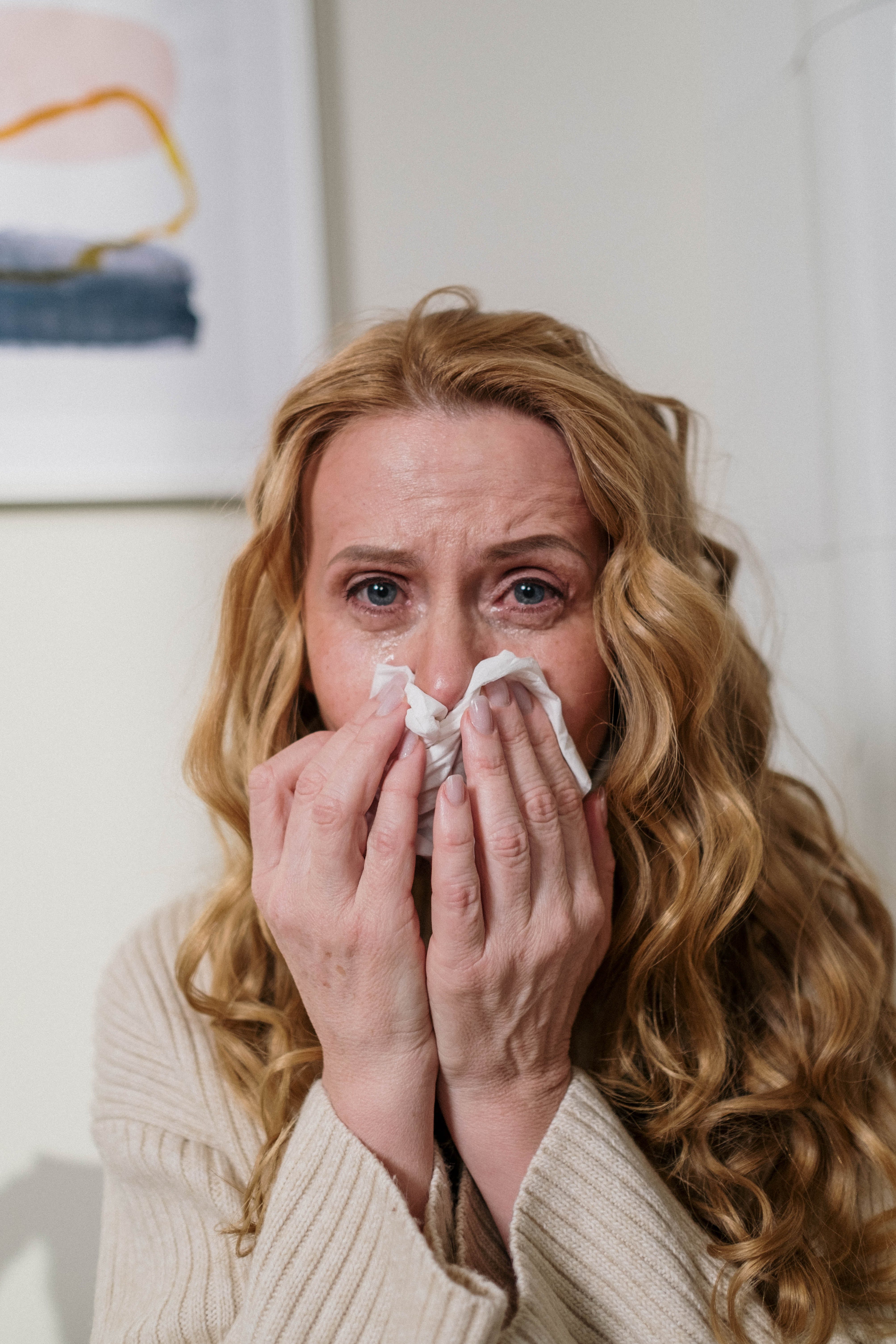 A woman suffering from allergies. | Source: Pexels