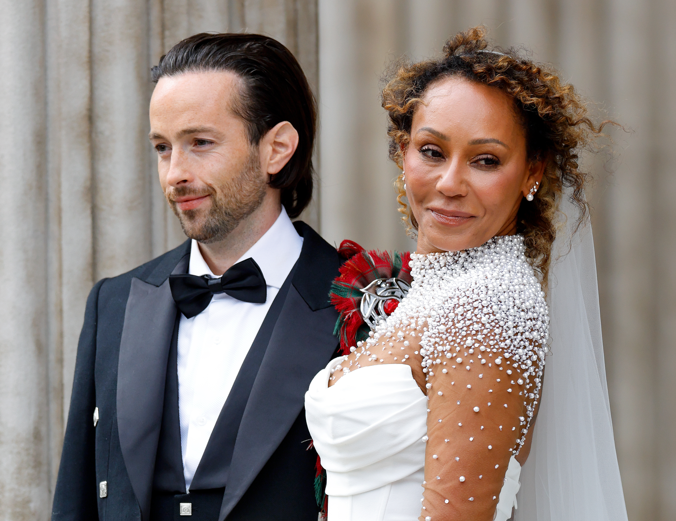 Rory McPhee and Mel B depart following their wedding in the OBE (Order of the British Empire) Chapel at St Paul's Cathedral on July 5, 2025 in London, England | Source: Getty Images