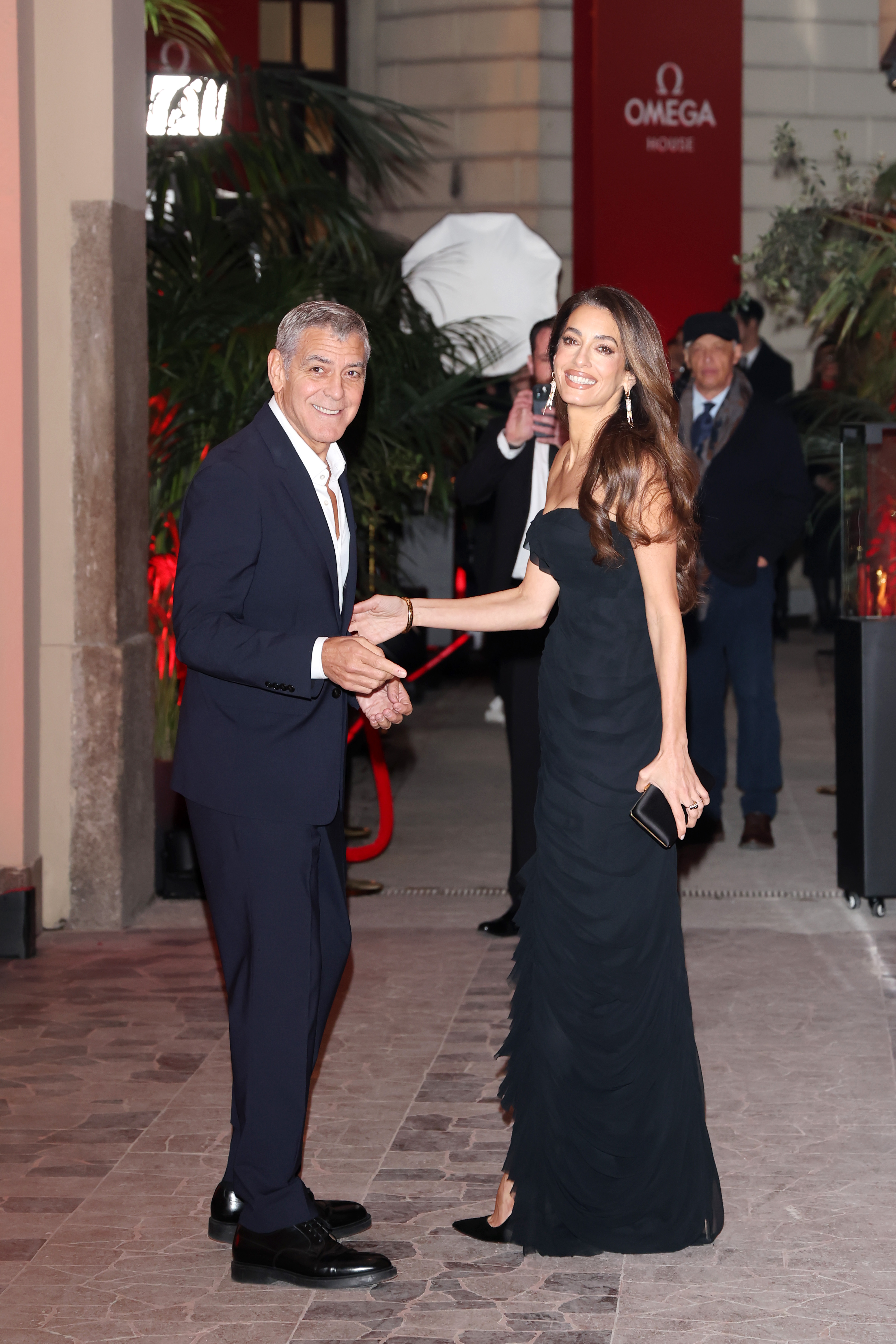 George Clooney and Amal Clooney attend the Omega House opening night during the Winter Olympic Games at Omega House on February 7, 2026, in Milan, Italy | Source: Getty Images