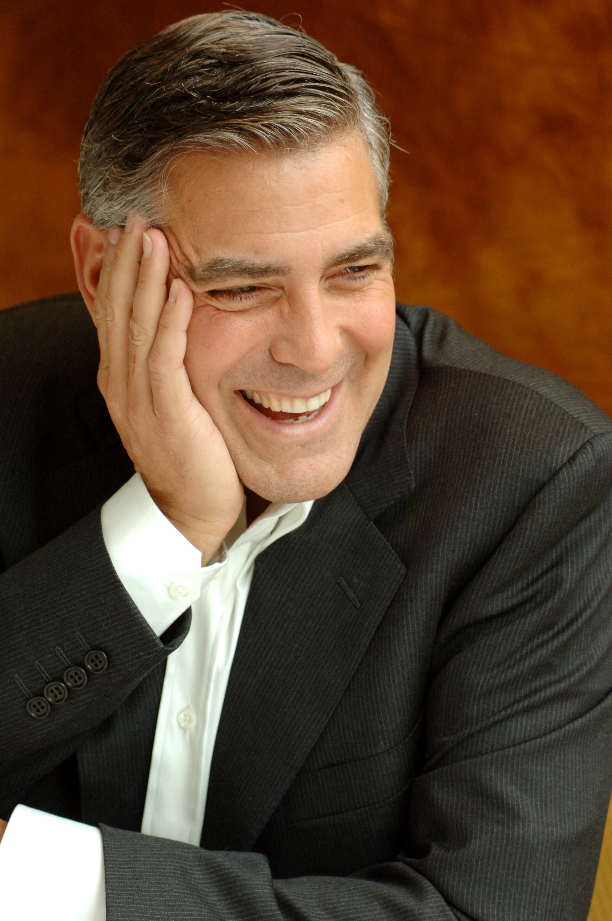 George Clooney laughing during a press conference for "The Good German" in Beverly Hills, California in 2006. | Source: Getty Images