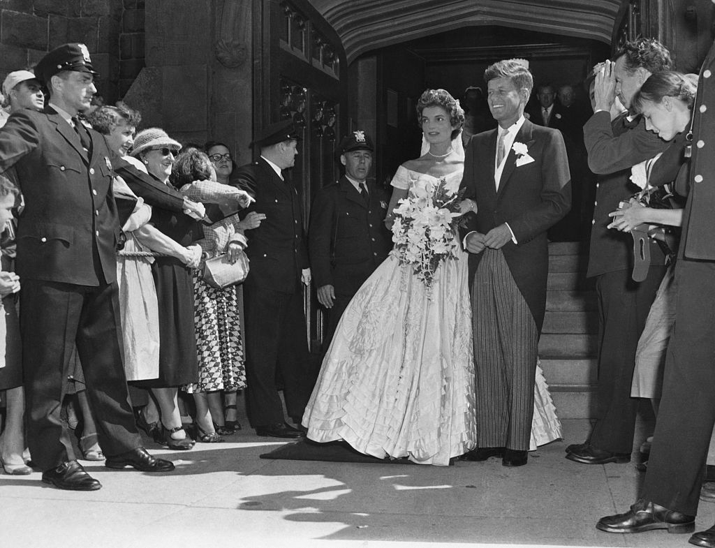 Jackie and John F. Kennedy with their wedding party after their church ceremony in 1953. | Source: Bettmann/Getty Images