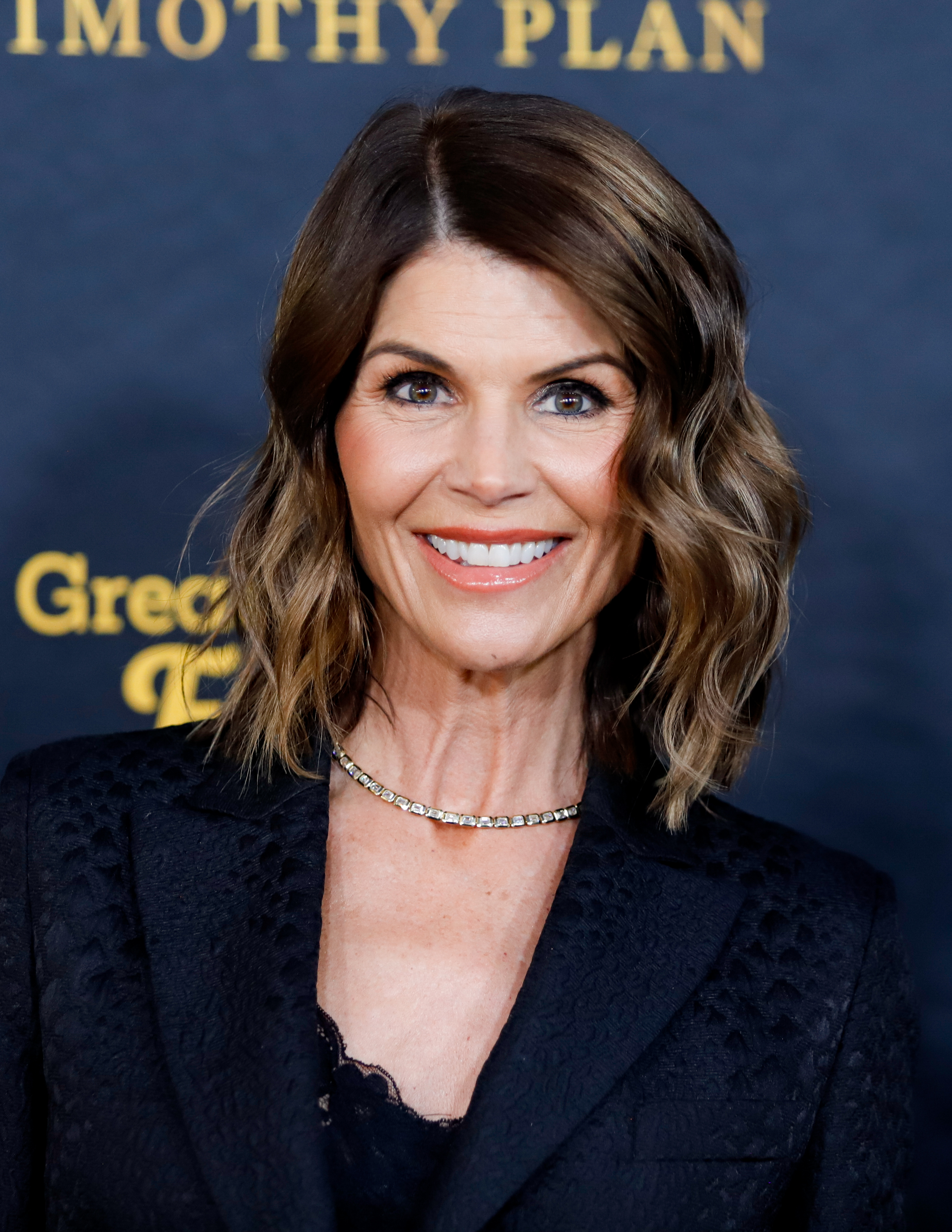 Loughlin kept it classic in a textured black blazer and elegant waves at the 31st Annual Movieguide Awards Gala.