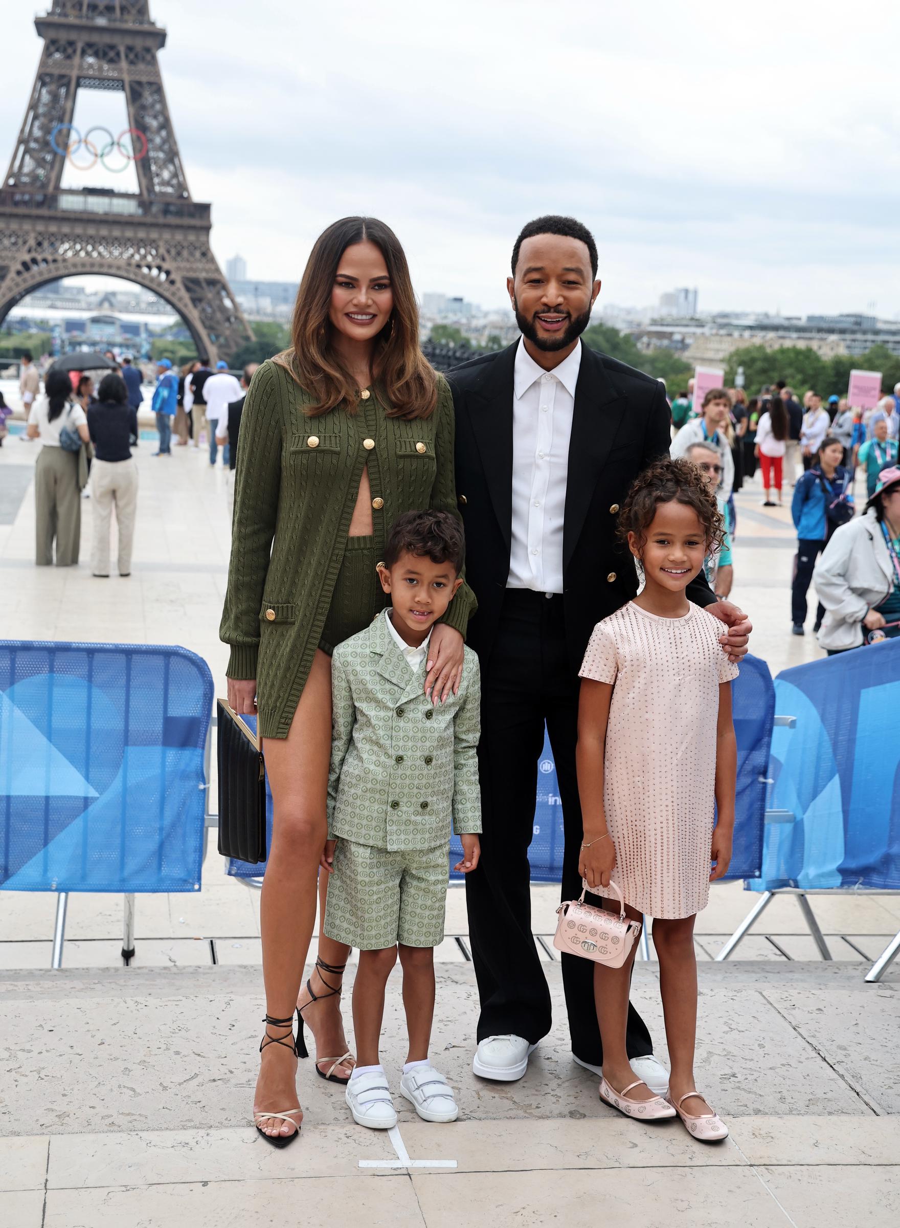 Chrissy Teigen, John Legend, and their children Luna and Miles attend the Paris 2024 Olympic Games Opening Ceremony at the Trocadero on July 26, 2024 | Source: Getty Images