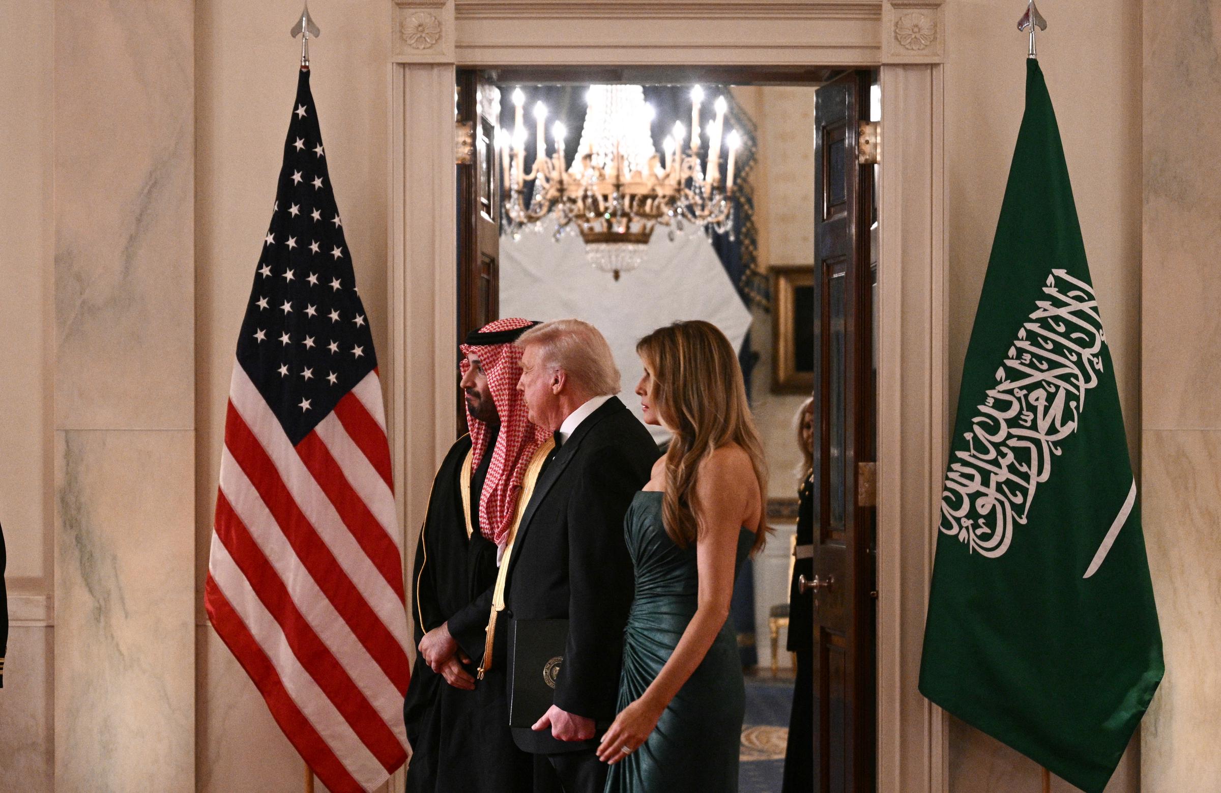 Saudi Crown Prince Mohammed bin Salman, U.S. President Donald Trump, and First Lady Melania Trump walk to the East Room for a state dinner at the White House, November 18, 2025 | Source: Getty Images