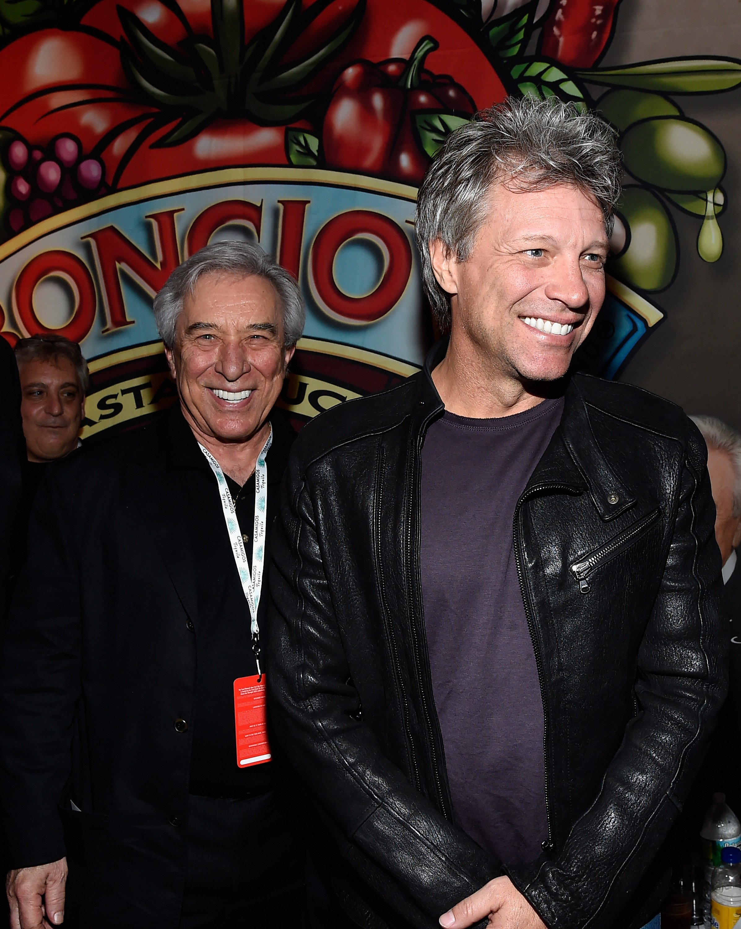 Jon Bon Jovi and\\u00a0John Francis Bongiovi Sr. posing at the Bongiovi Brand chef station at Ronzoni's La Sagra Slices at Esurance Rooftop Pier 92 in New York City\\u00a0on October 16, 2014. | Source: Getty Images