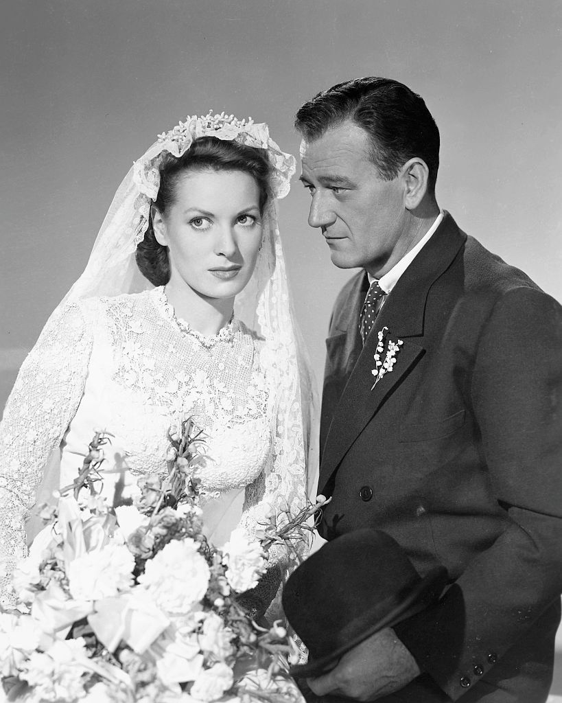 Actors John Wayne (1907 - 1979) as Sean Thornton and Maureen O'Hara (1920 - 2015) as Mary Kate Danaher in a publicity still for the film 'The Quiet Man', 1952. | Source: Getty Images