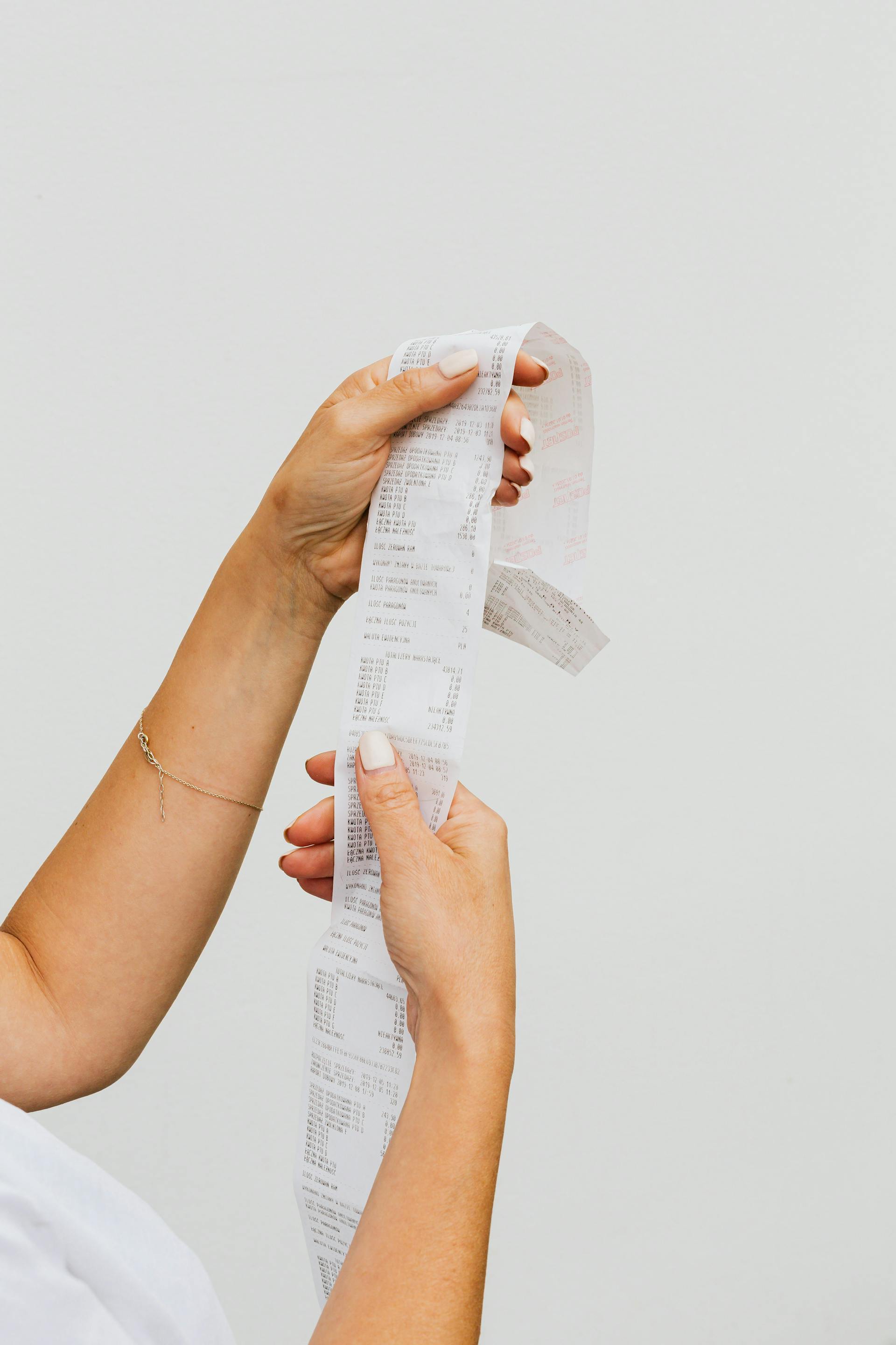 A person holding a receipt | Source: Pexels
