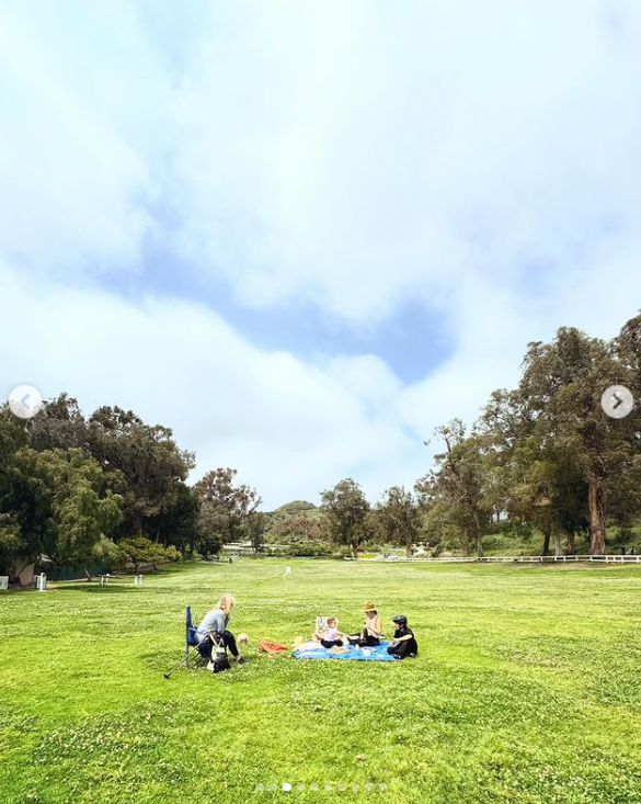 Kate Hudson enjoying a picnic outdoors with her children in a photo shared in April 2024. | Source: Instagram/katehudson