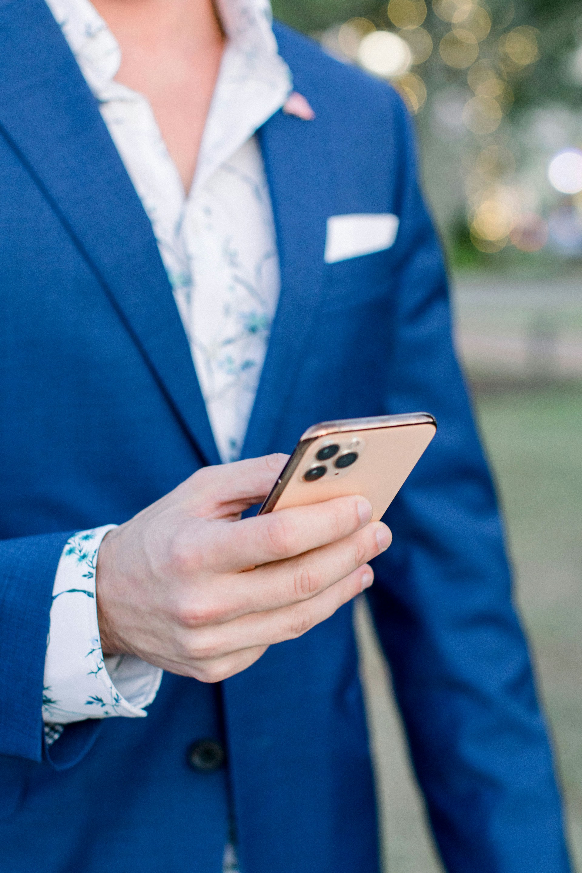 Close-up of a man holding a smartphone | Source: Unsplash