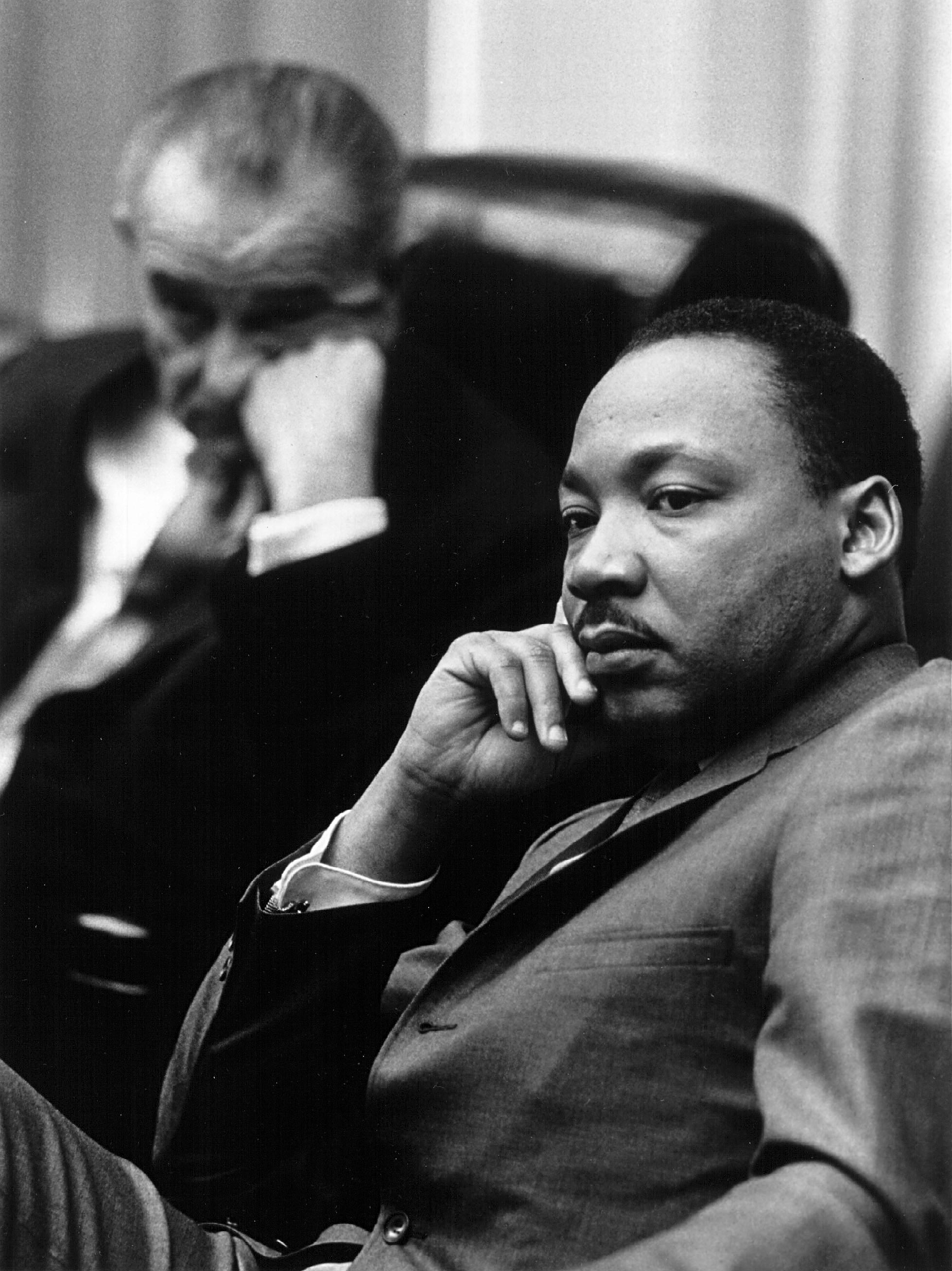 Rev. Martin Luther King Jr. with President Lyndon B. Johnson in the background March 18, 1966 at the White House. | Photo: GettyImages