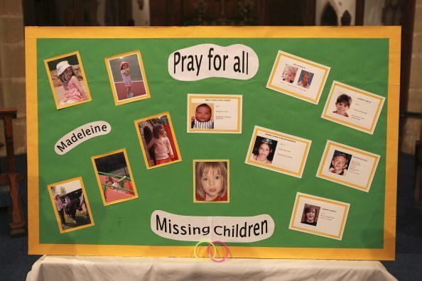  A board with photographs of missing Madeline McCann and other missing children made by a parishoner