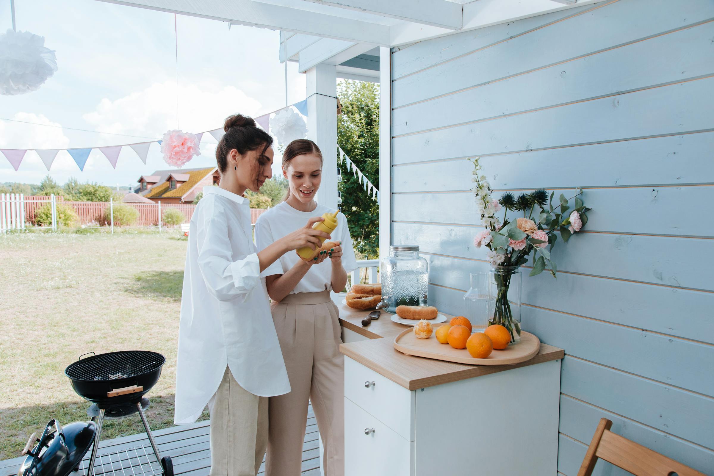 Two women at a decorated yard | Source: Pexels