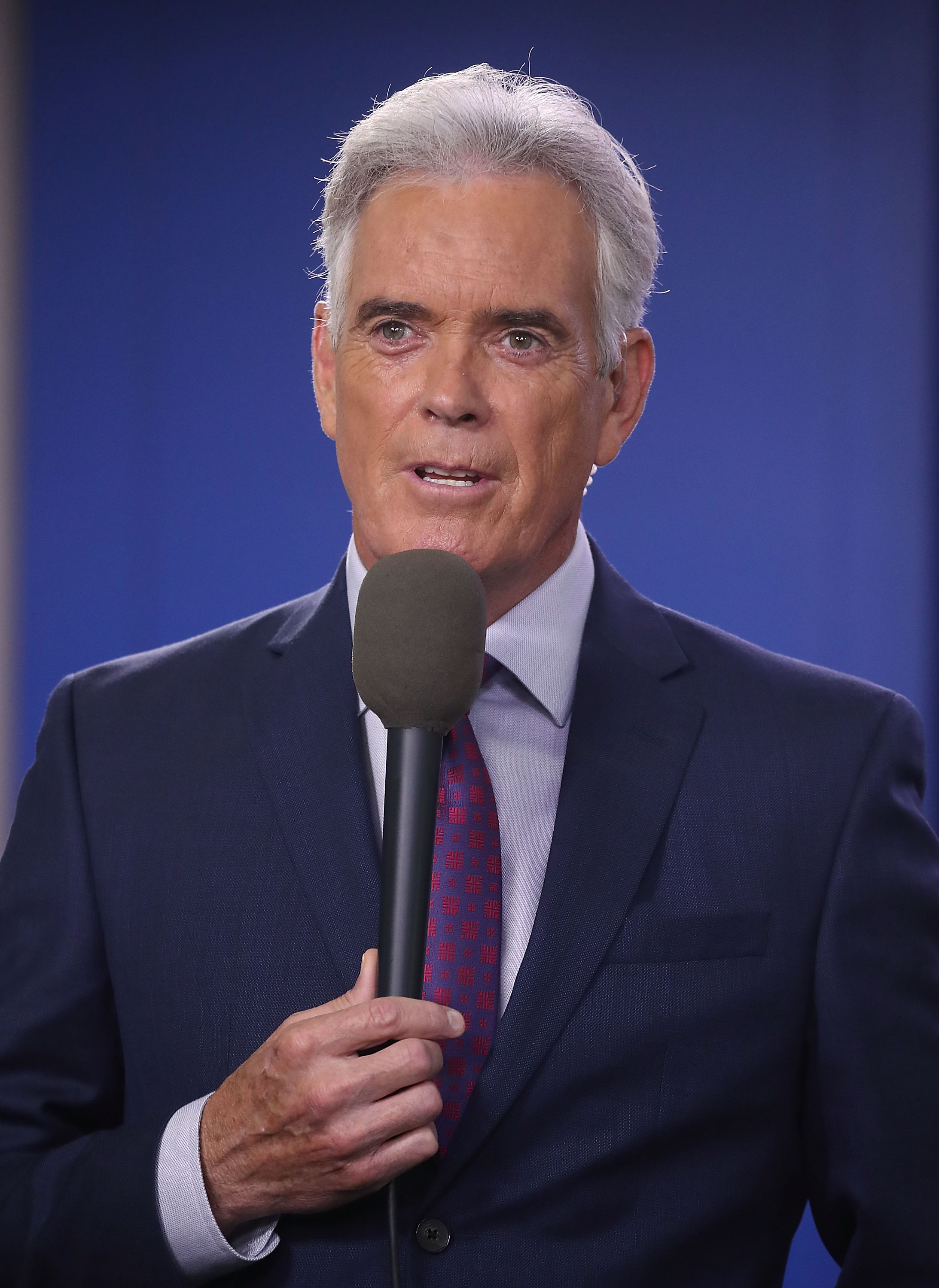 John Roberts reporting from the briefing room at the White House on August 2, 2018, in Washington, D.C. | Source: Getty Images