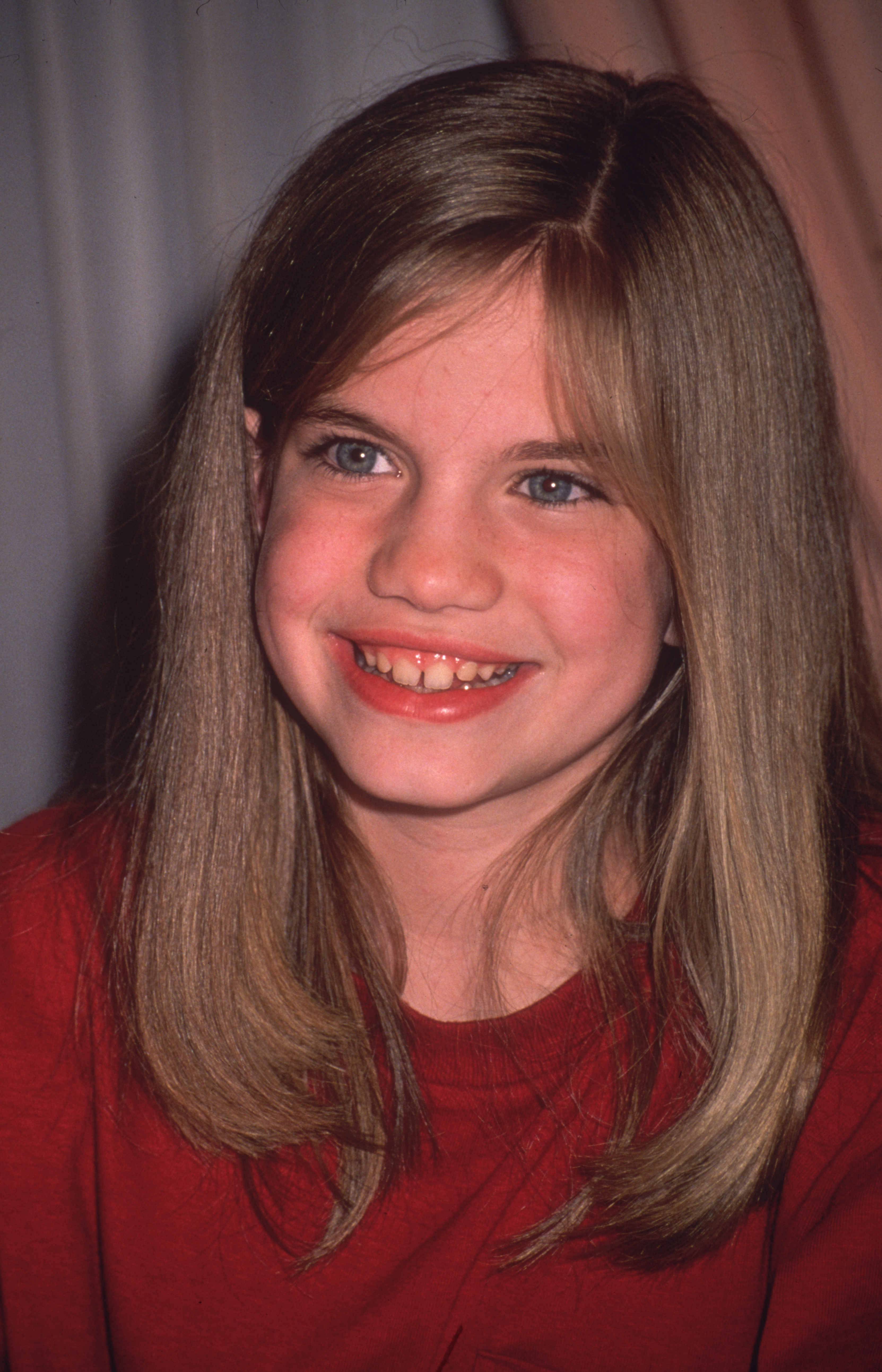 Anna Chlumsky smiling in a headshot circa 1995 | Source: Getty Images